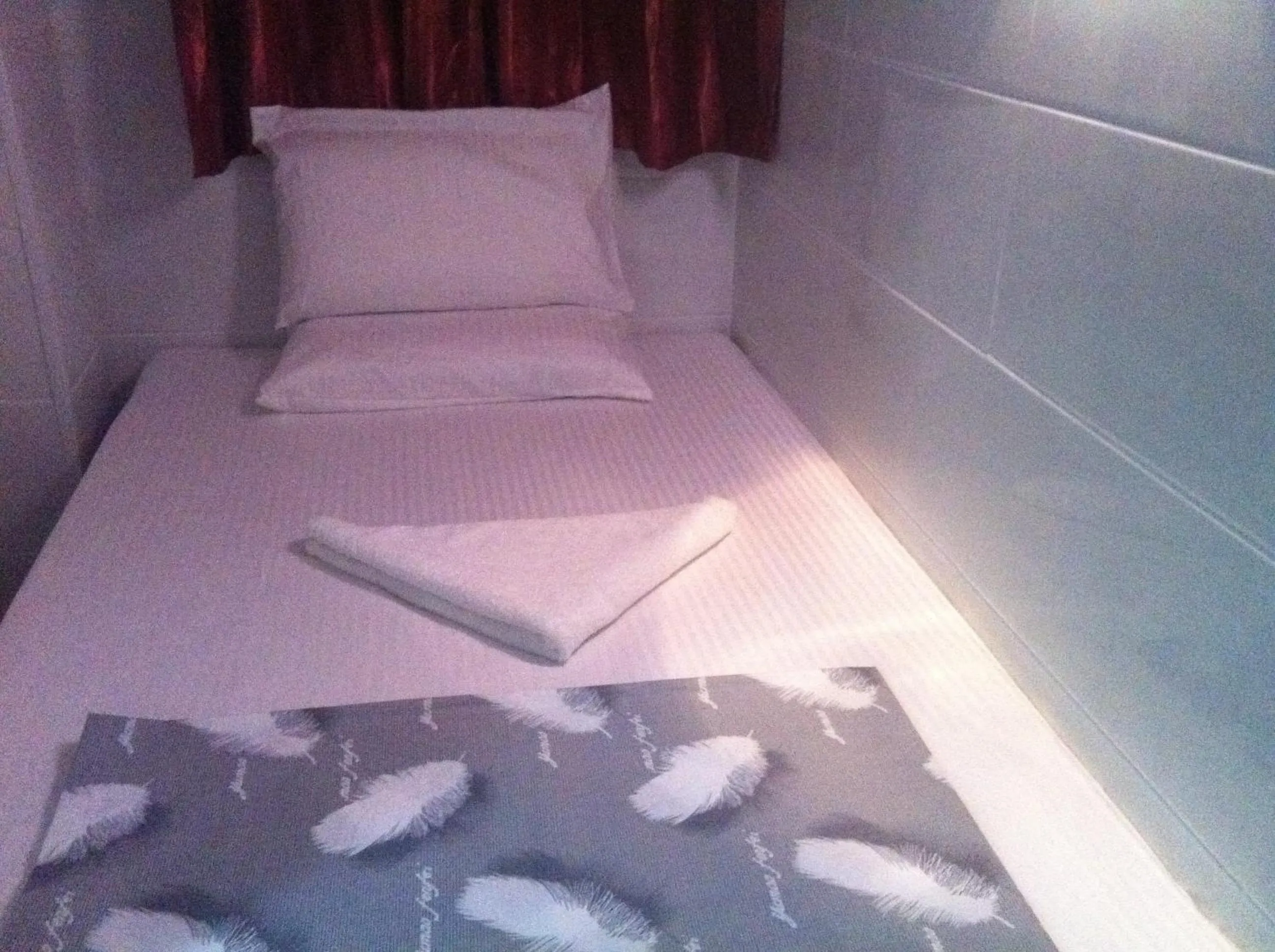 Bed in New Cosmos Hotel