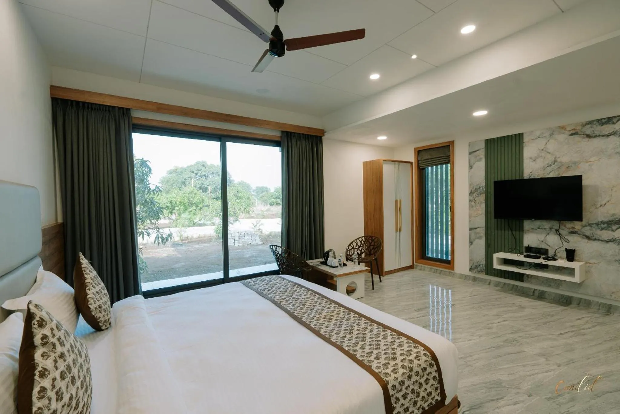 Bedroom in Daksh Eden Greenz -A Luxury Resort in Sasan Gir