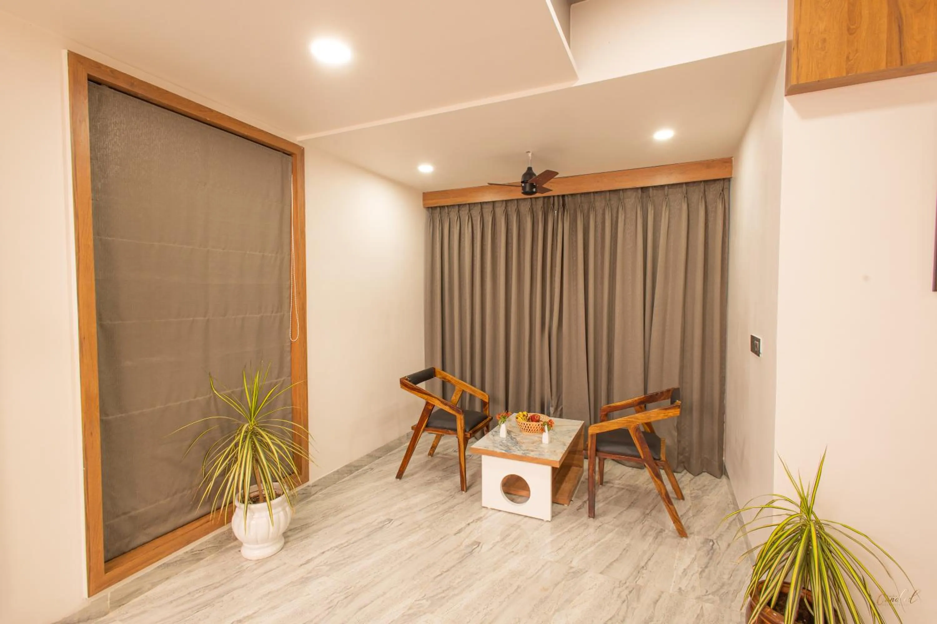 Seating area in Daksh Eden Greenz -A Luxury Resort in Sasan Gir