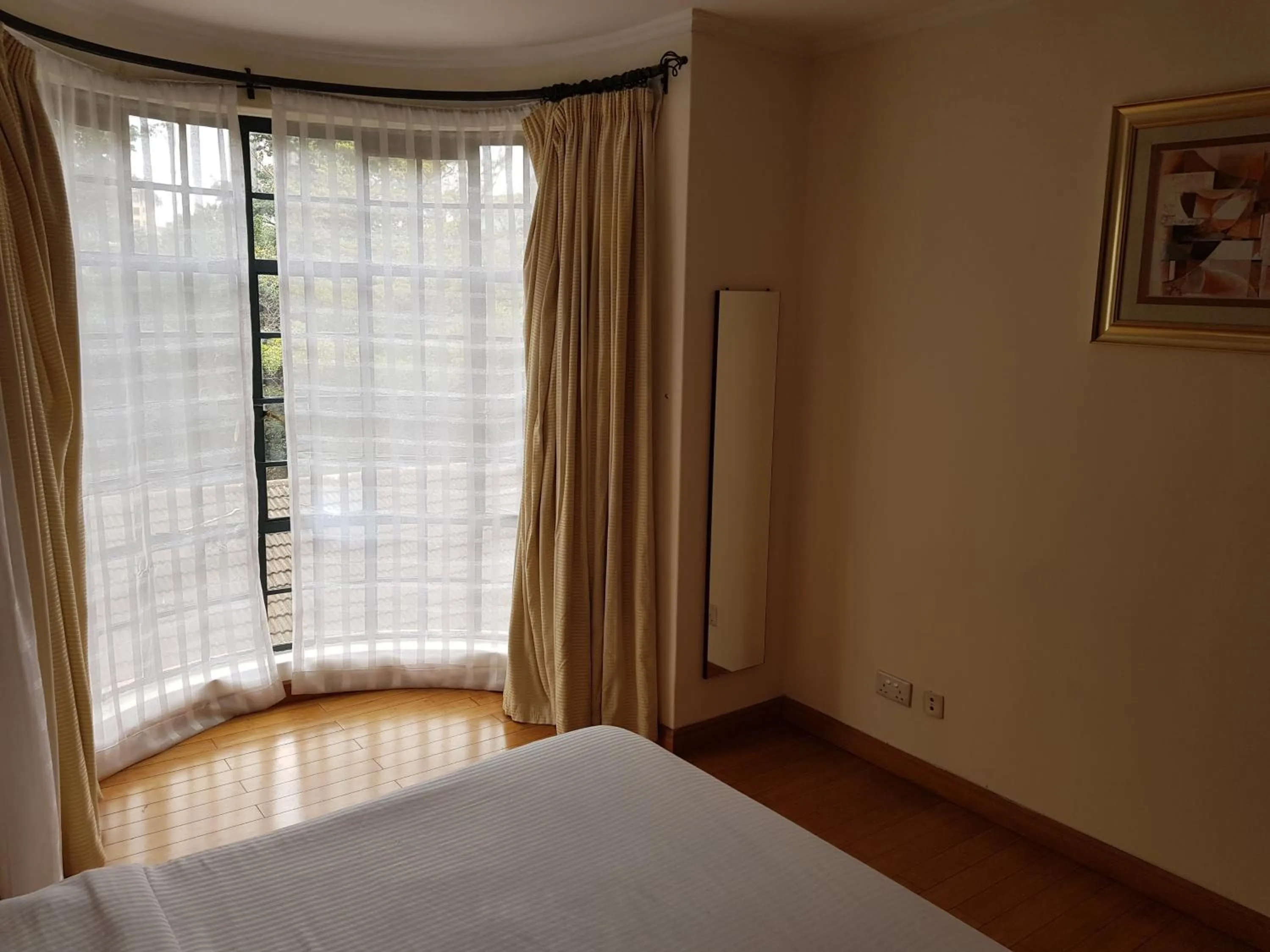 Bed in Natural Oak Apartments