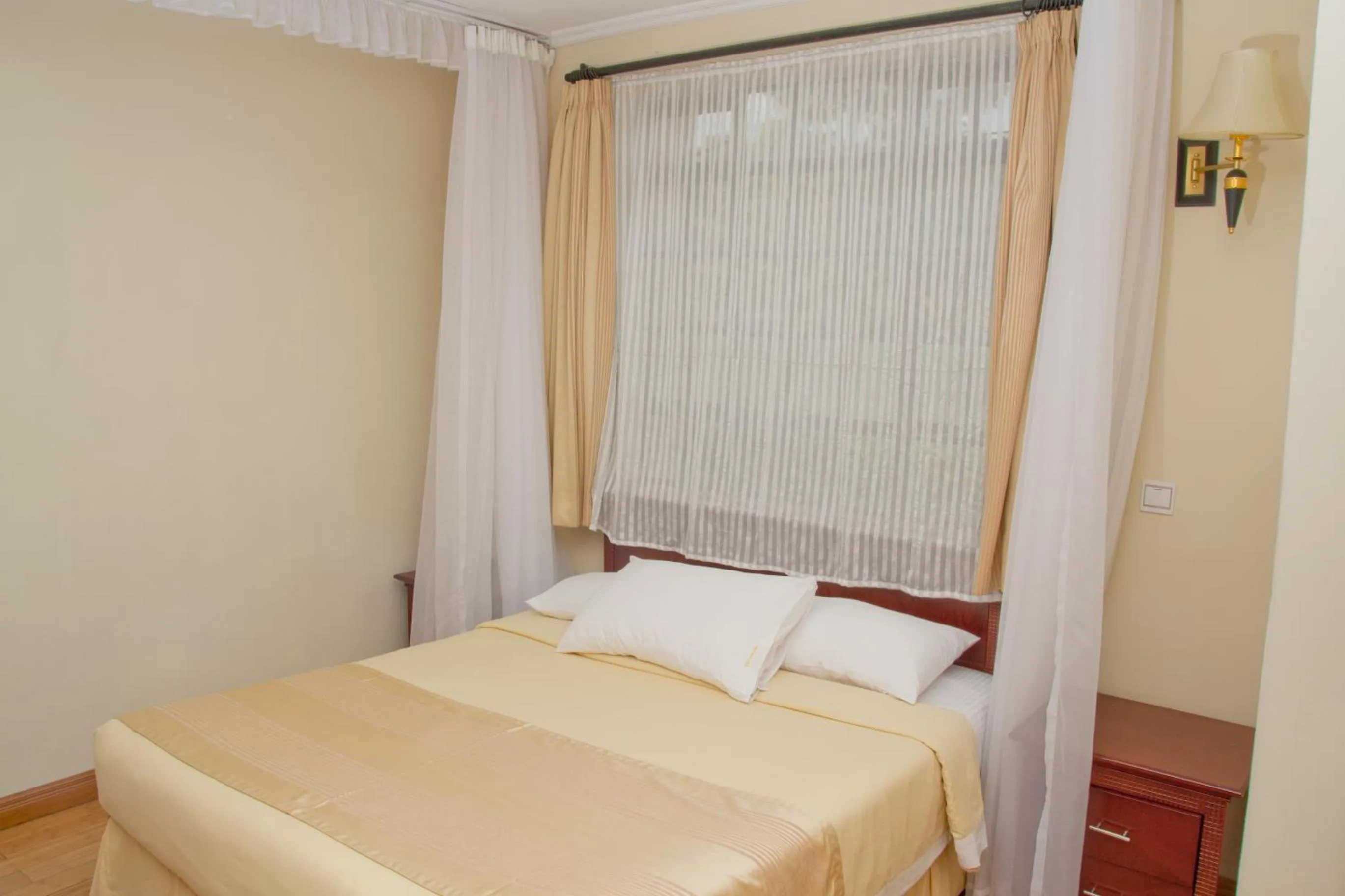 Bed in Natural Oak Apartments