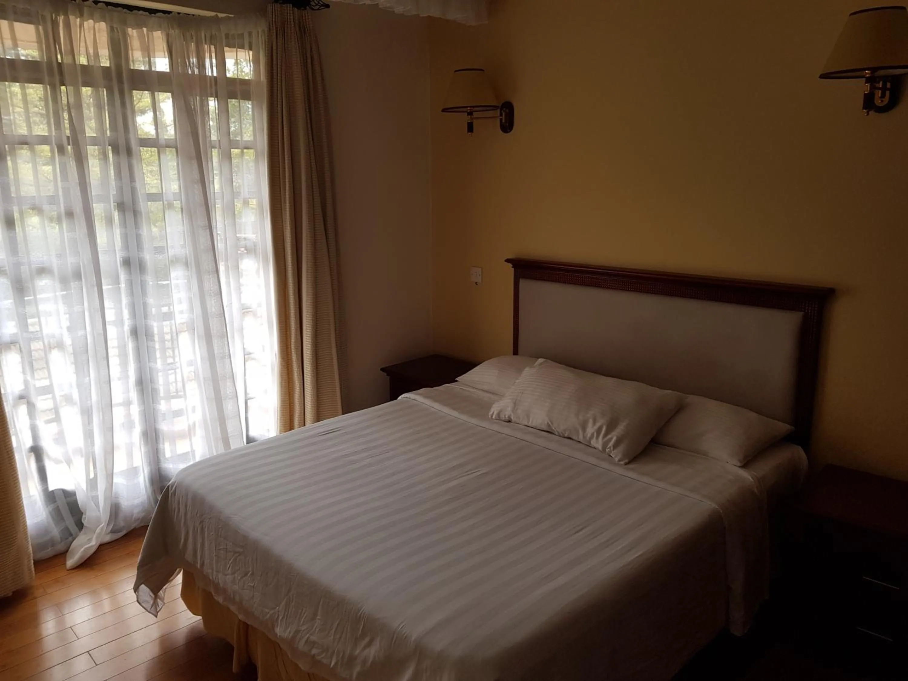 Bed in Natural Oak Apartments