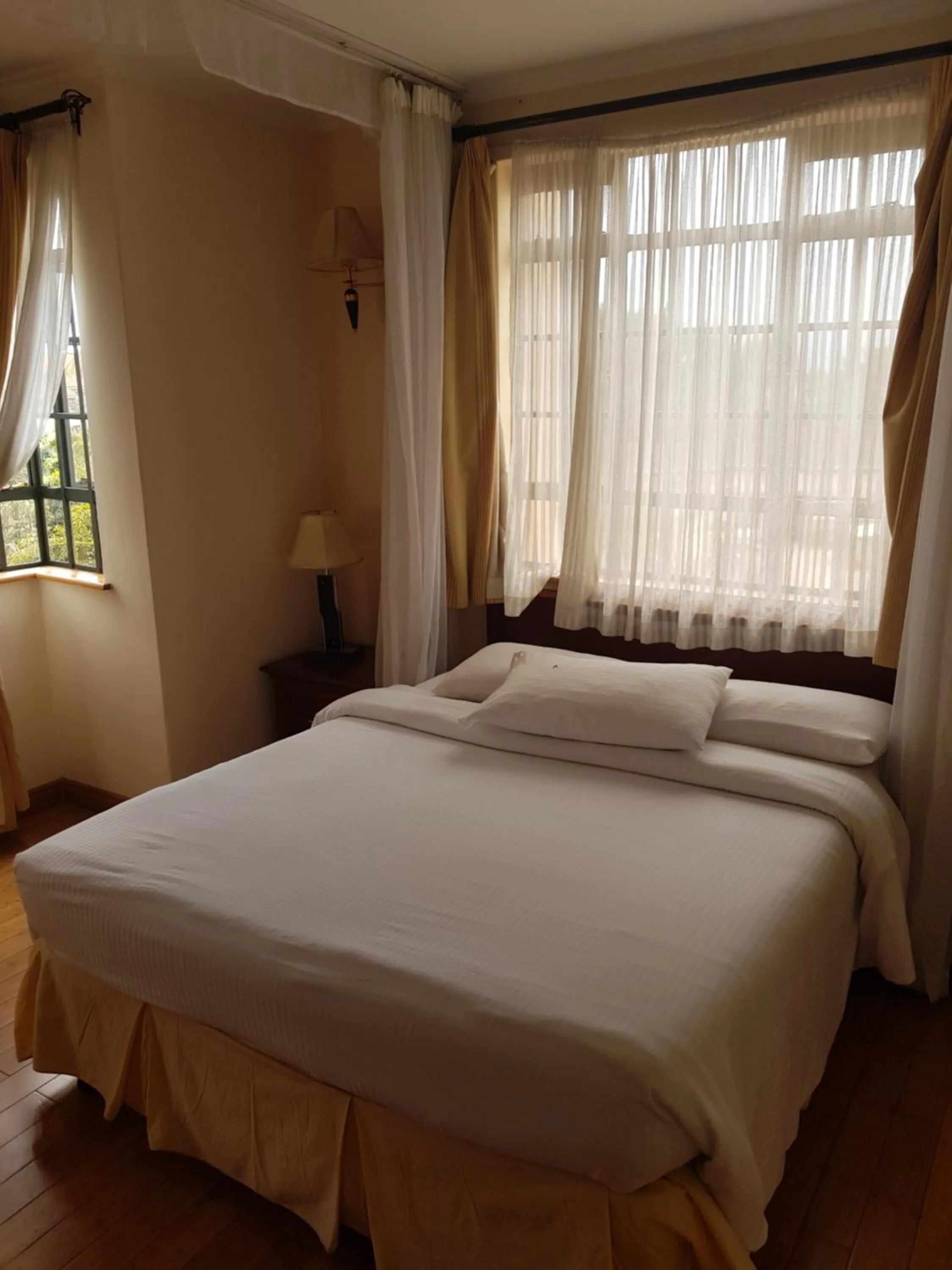 Bed in Natural Oak Apartments