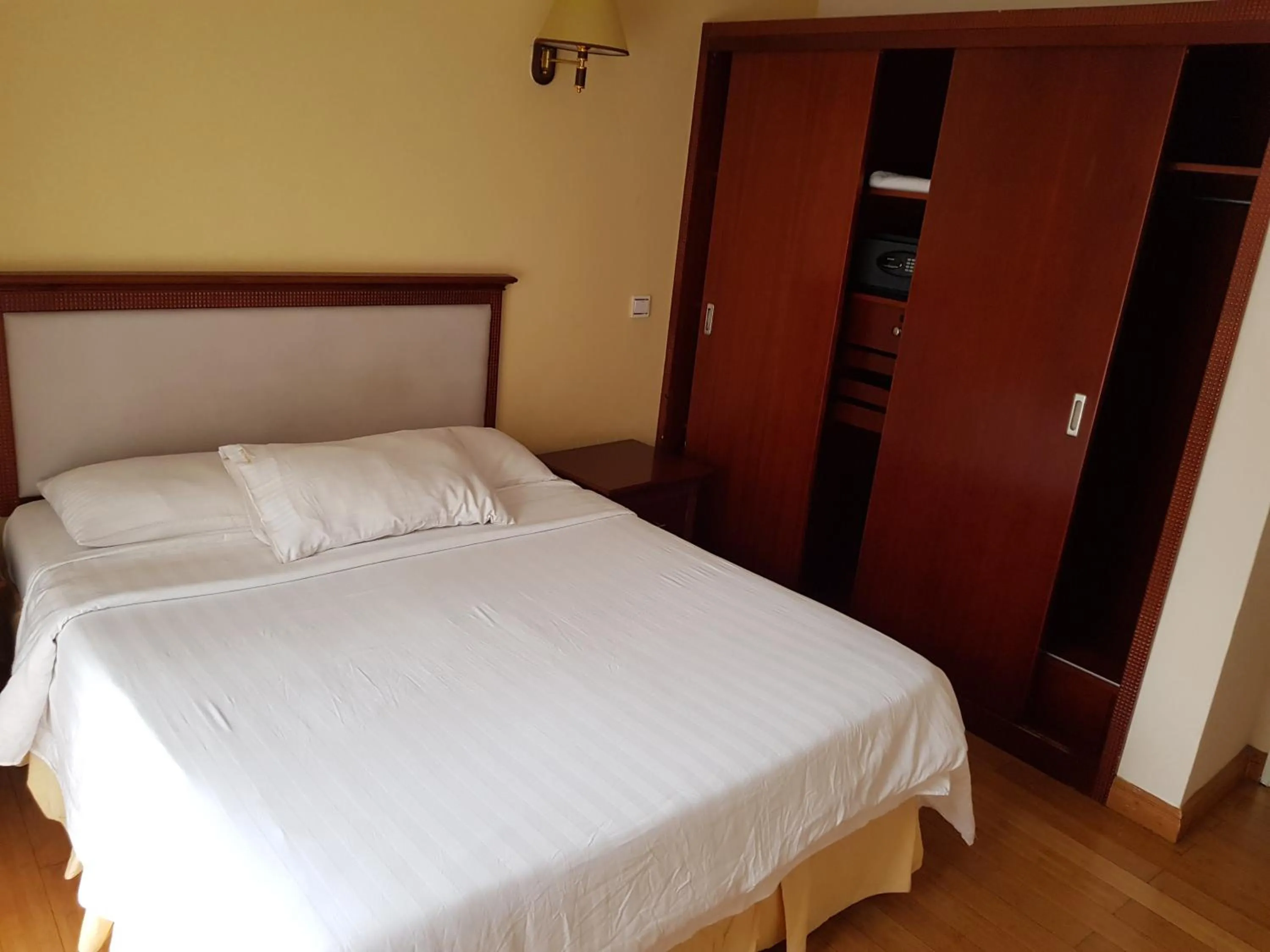 Bed in Natural Oak Apartments