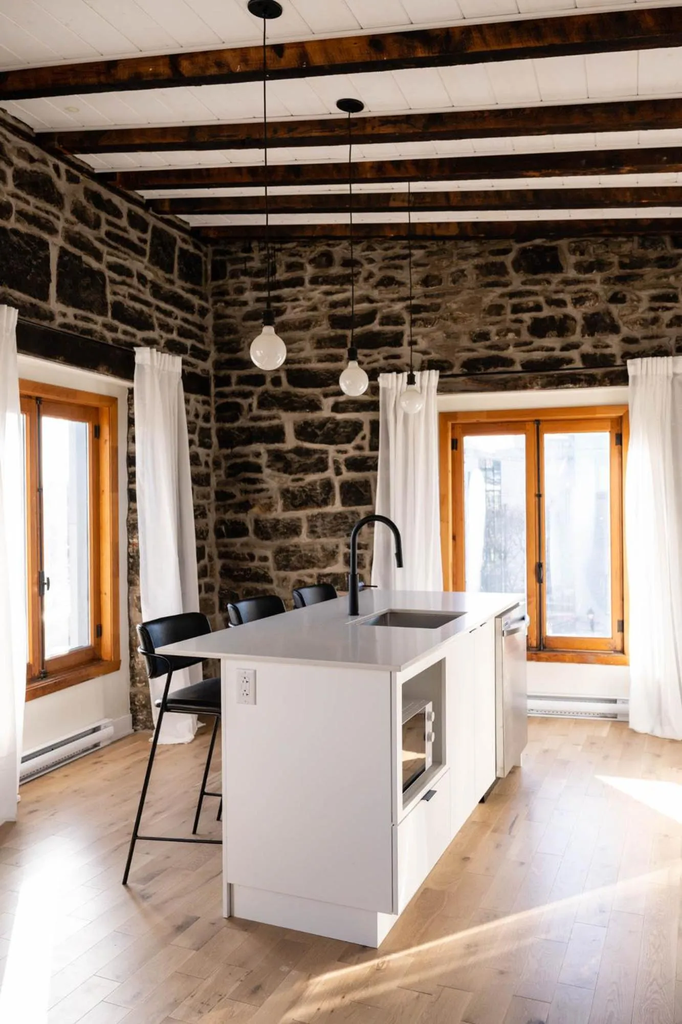 Dining area in Maison Place Royale by Luxury In Transit