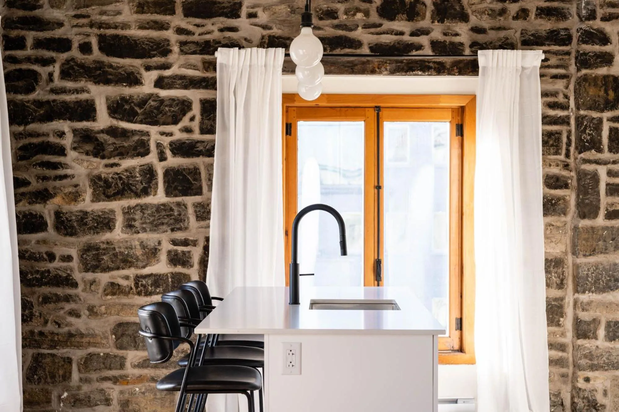 Dining area in Maison Place Royale by Luxury In Transit