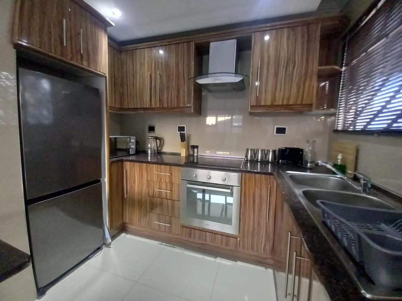 Kitchen or kitchenette in Loddey`s Guest House - by Beach Collection