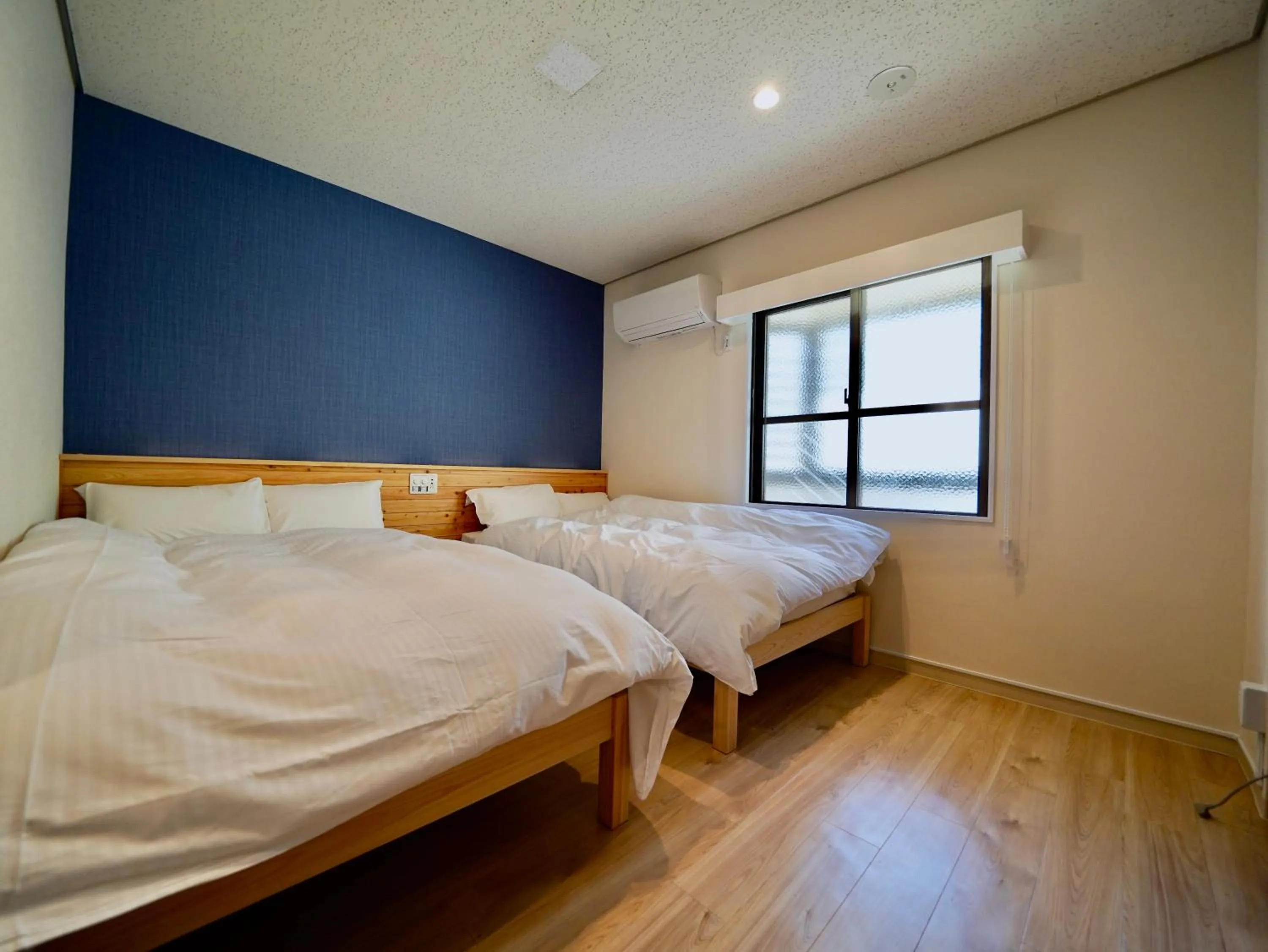 Bed in Hotel Ishigaki and Chikonkiya