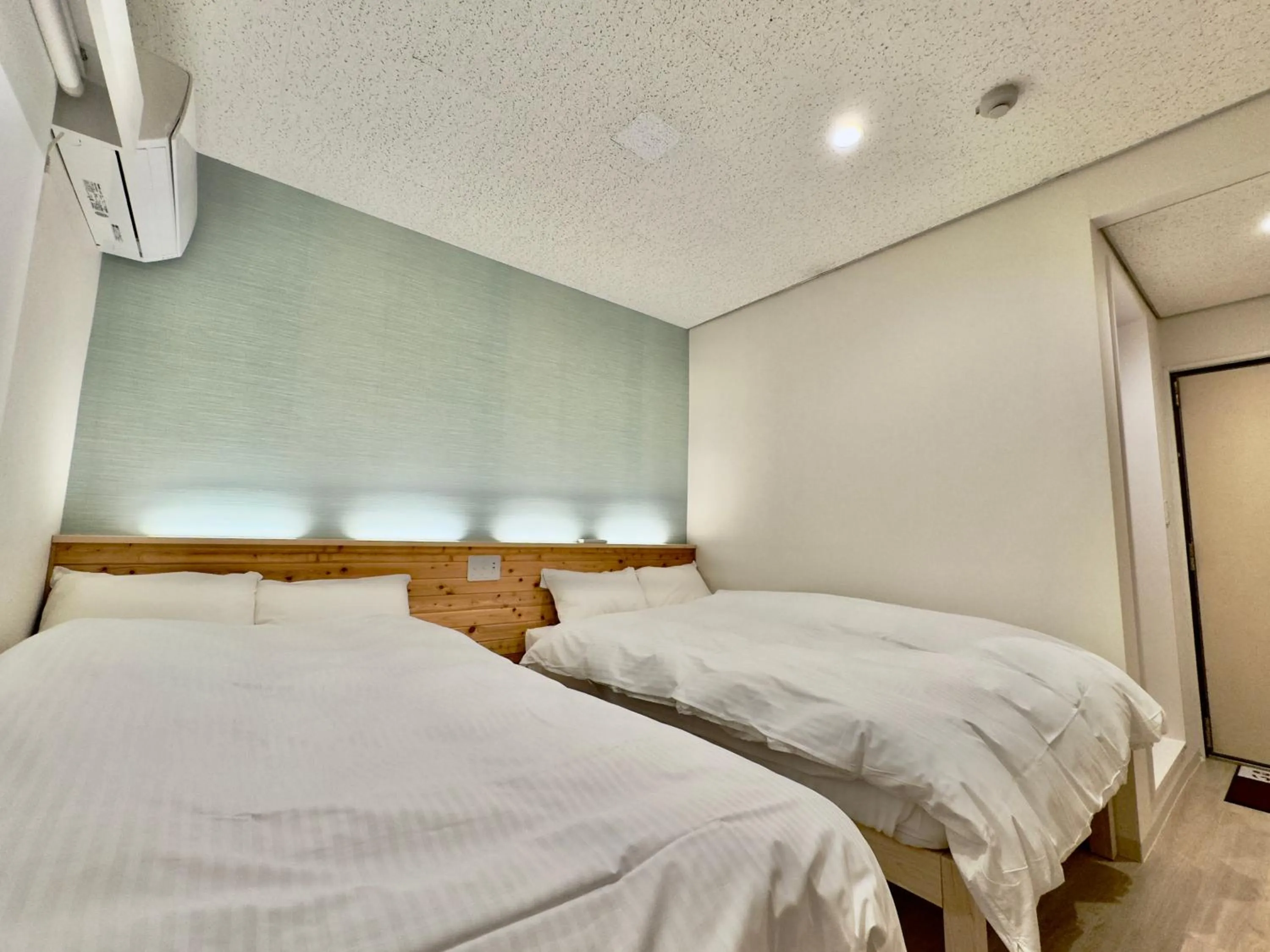 Bed in Hotel Ishigaki and Chikonkiya