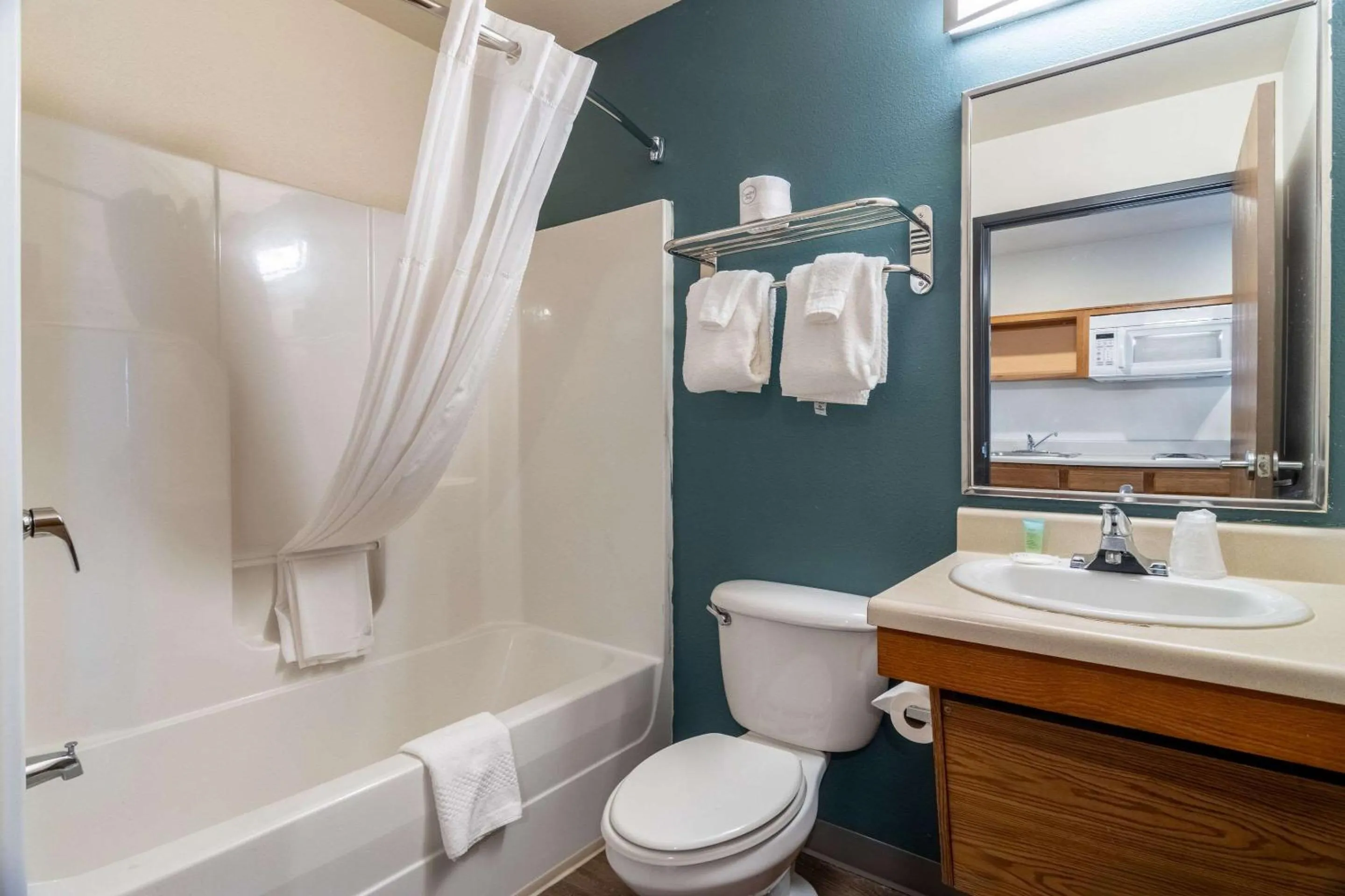 Bedroom in WoodSpring Suites Champaign near University