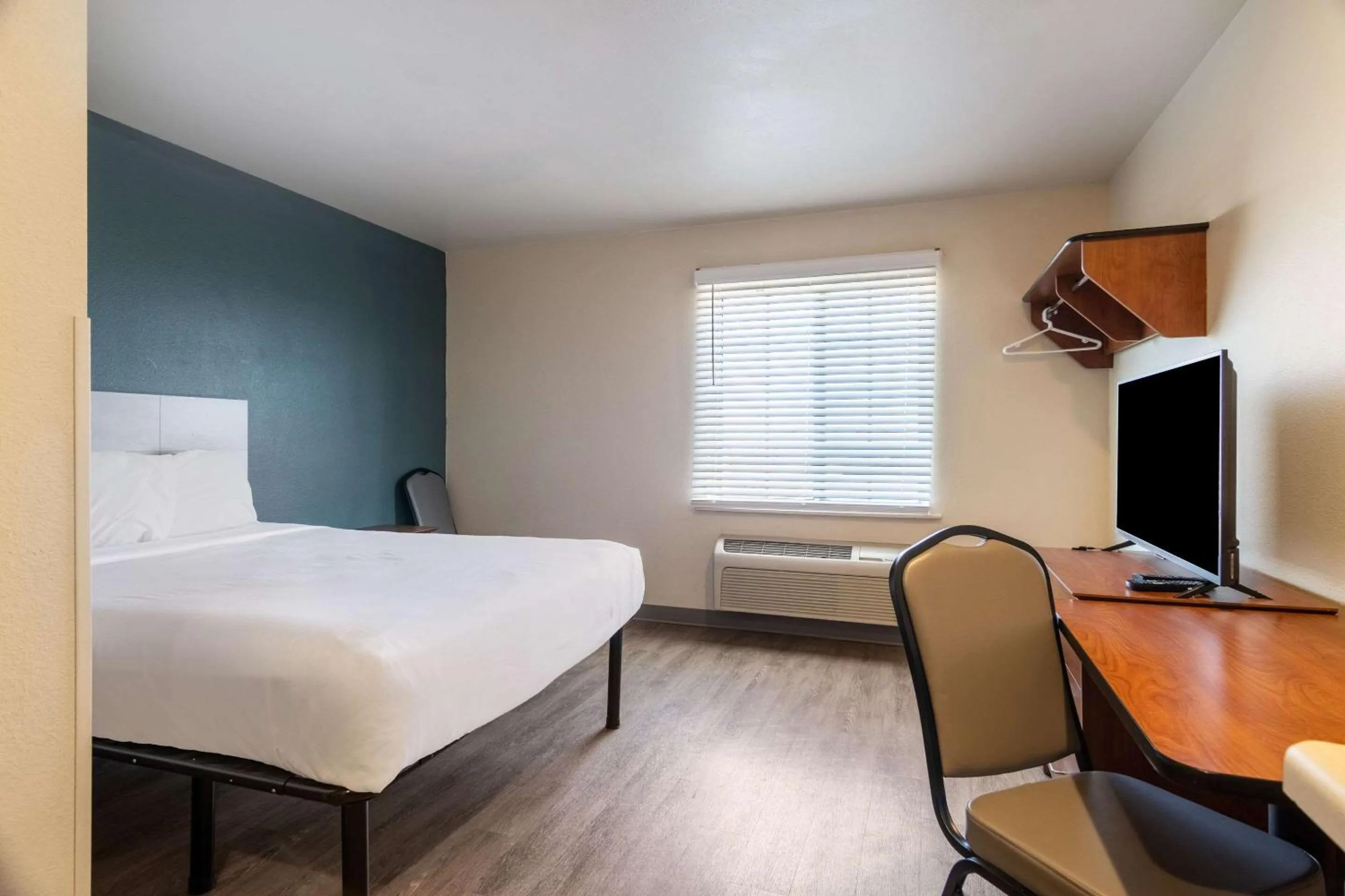 Bedroom, Bed in WoodSpring Suites Champaign near University