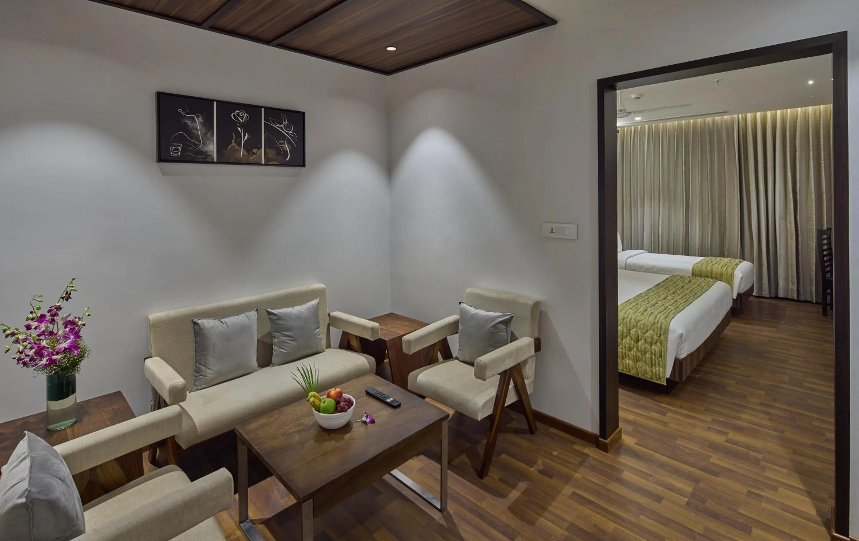 Seating area, Bed in Grand Continent Hosur A Sarovar Portico Affiliate Hotel