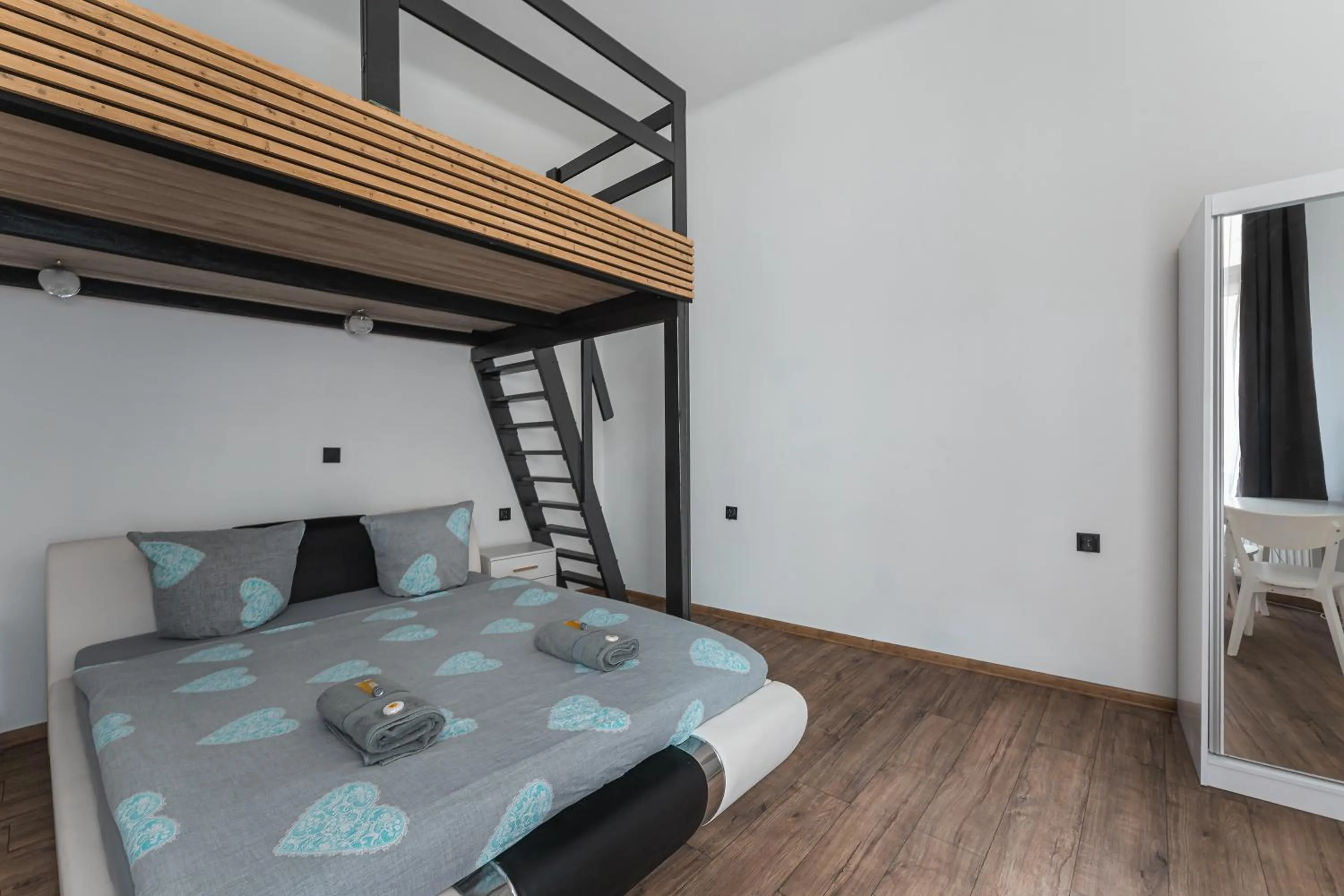 Bed in Queen Apartments