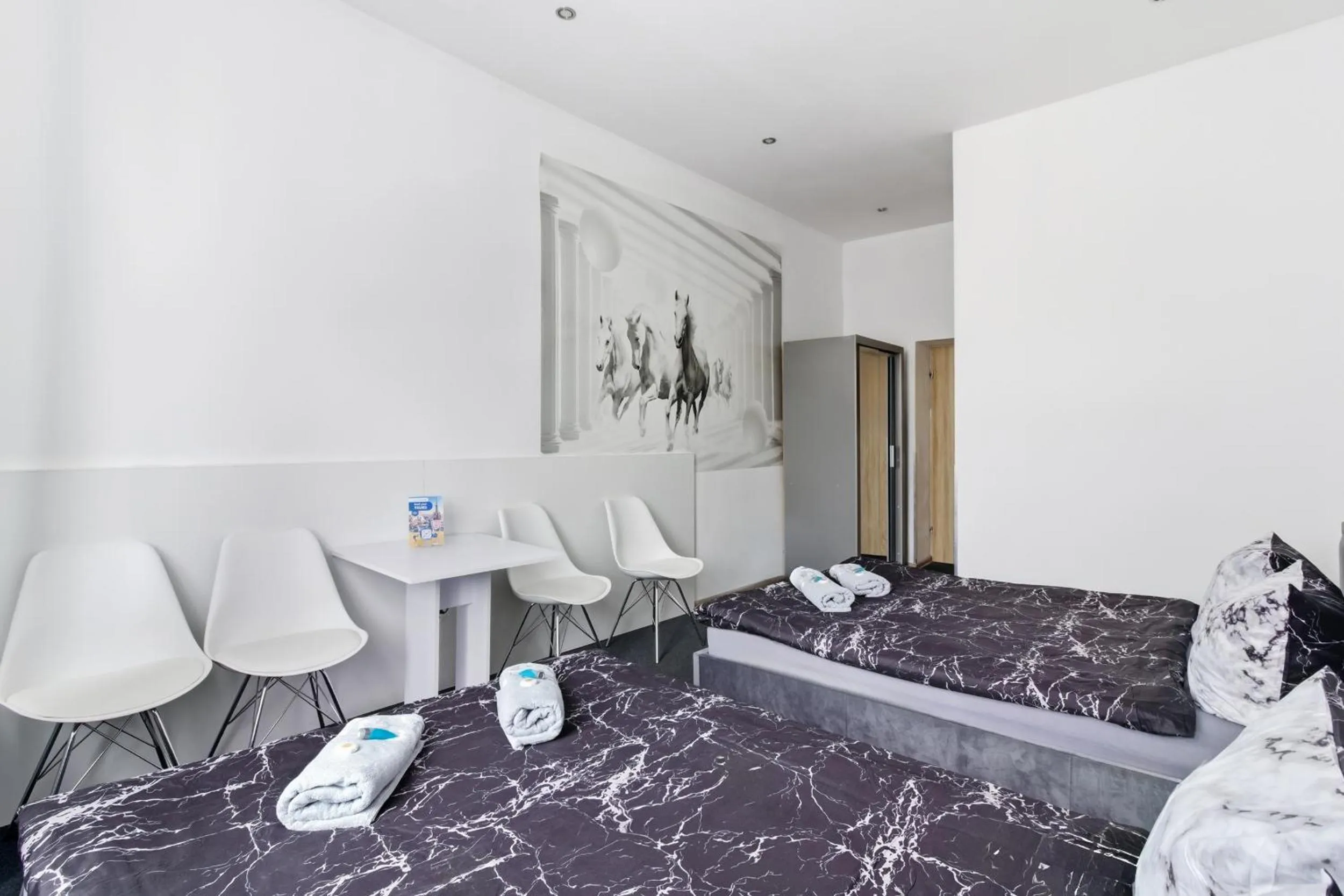 Bed in Queen Apartments