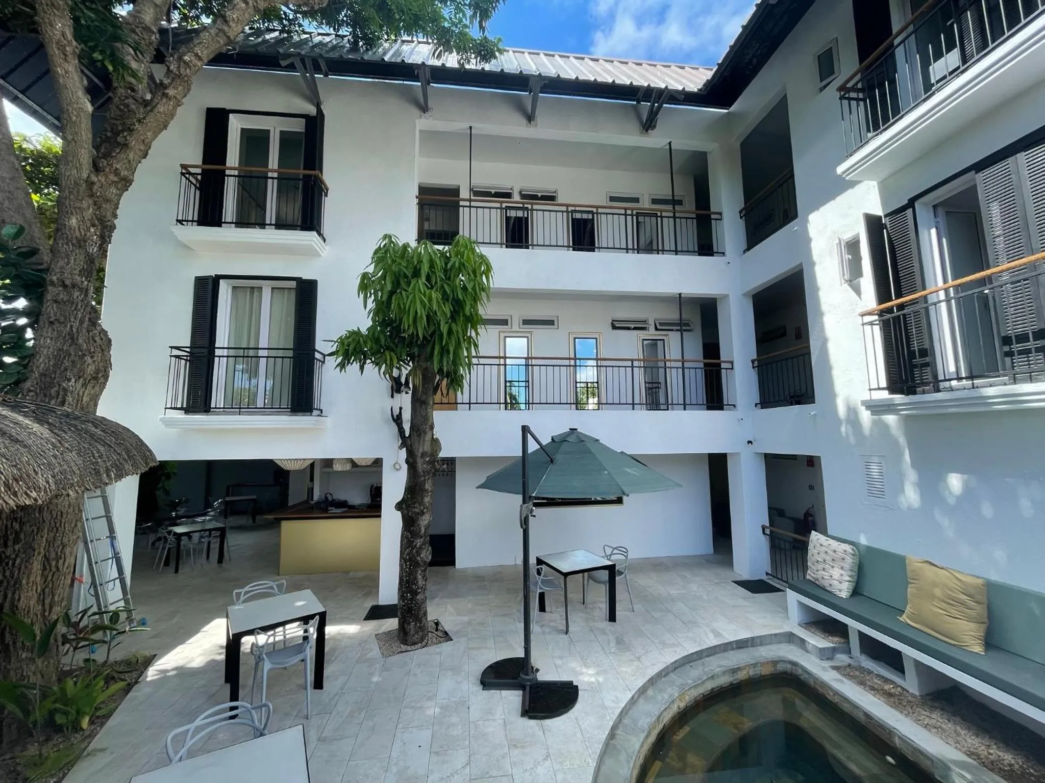 Property building in Cosy Guest House Sous le Badamier