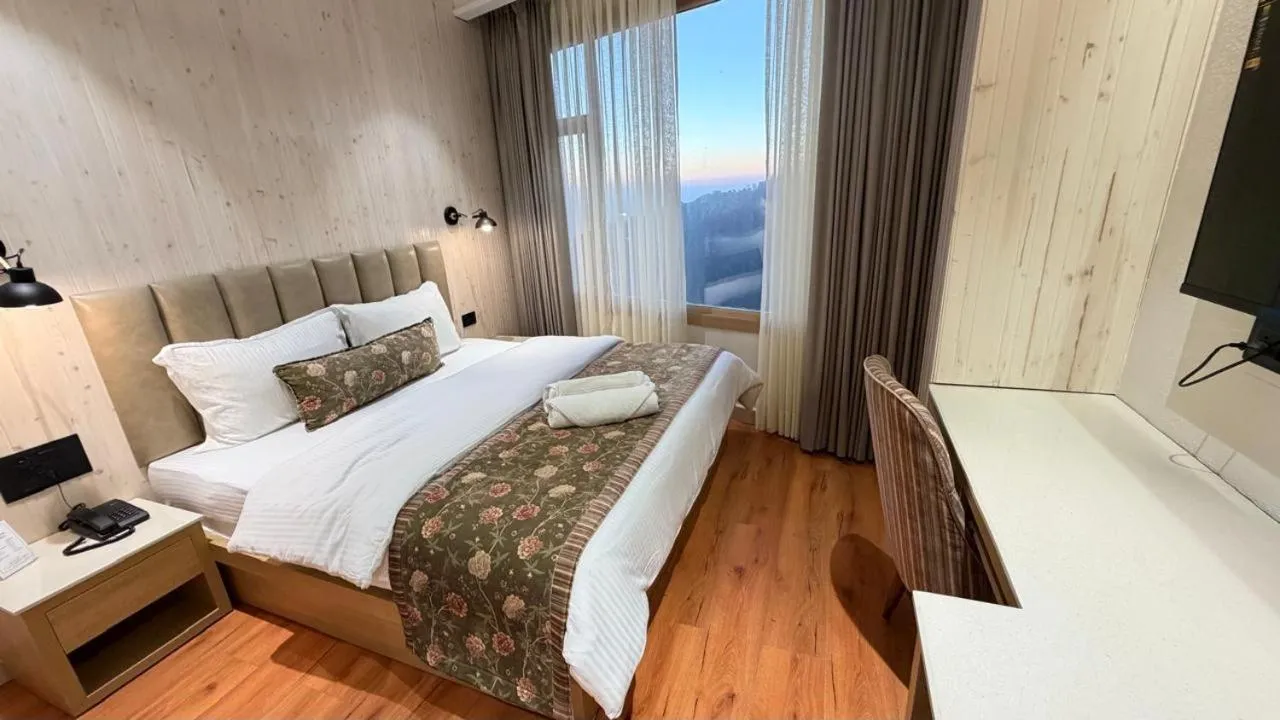 Bed in Hotel M AND RESORT