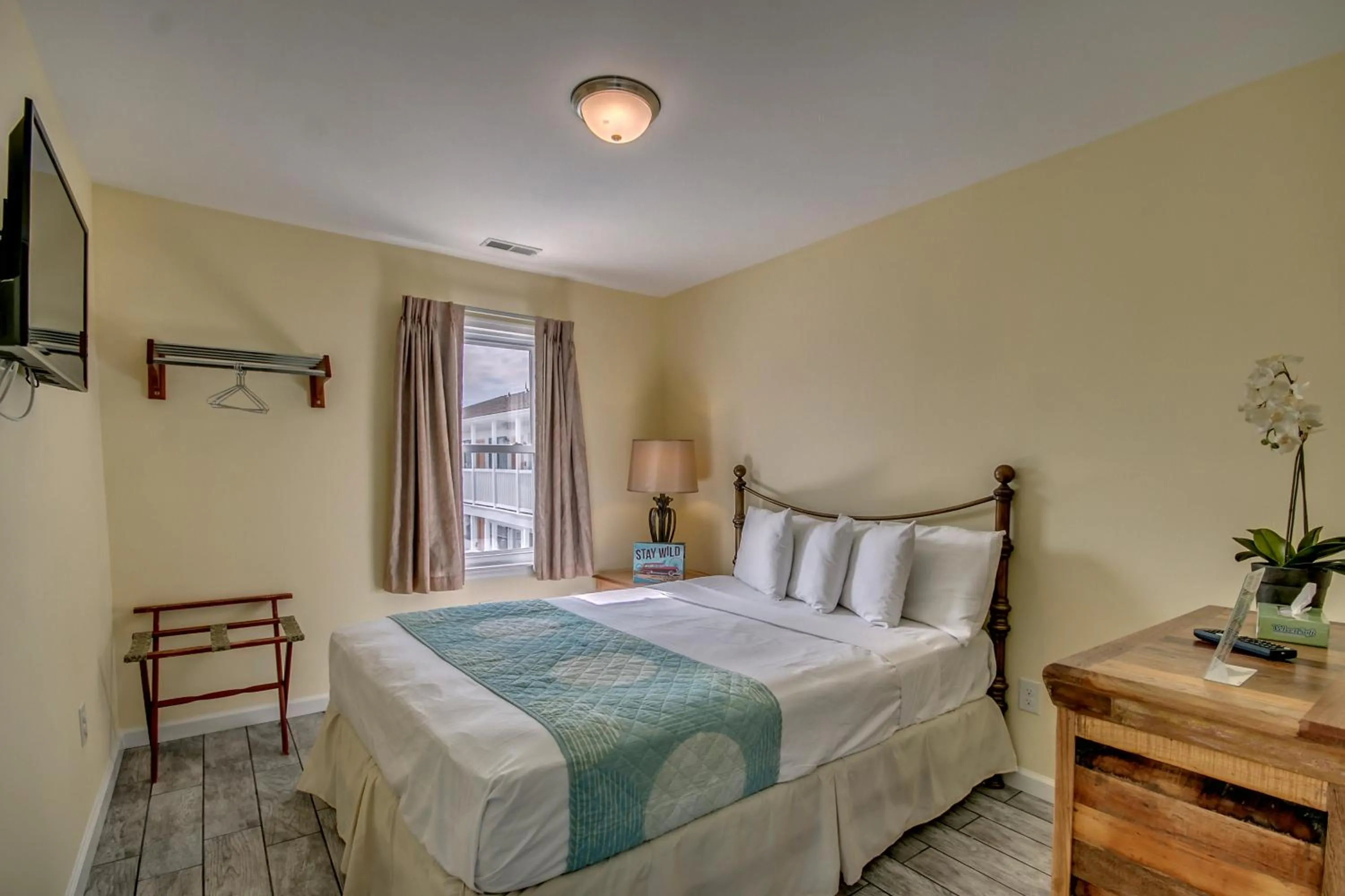 Bed in Daytona Inn and Suites