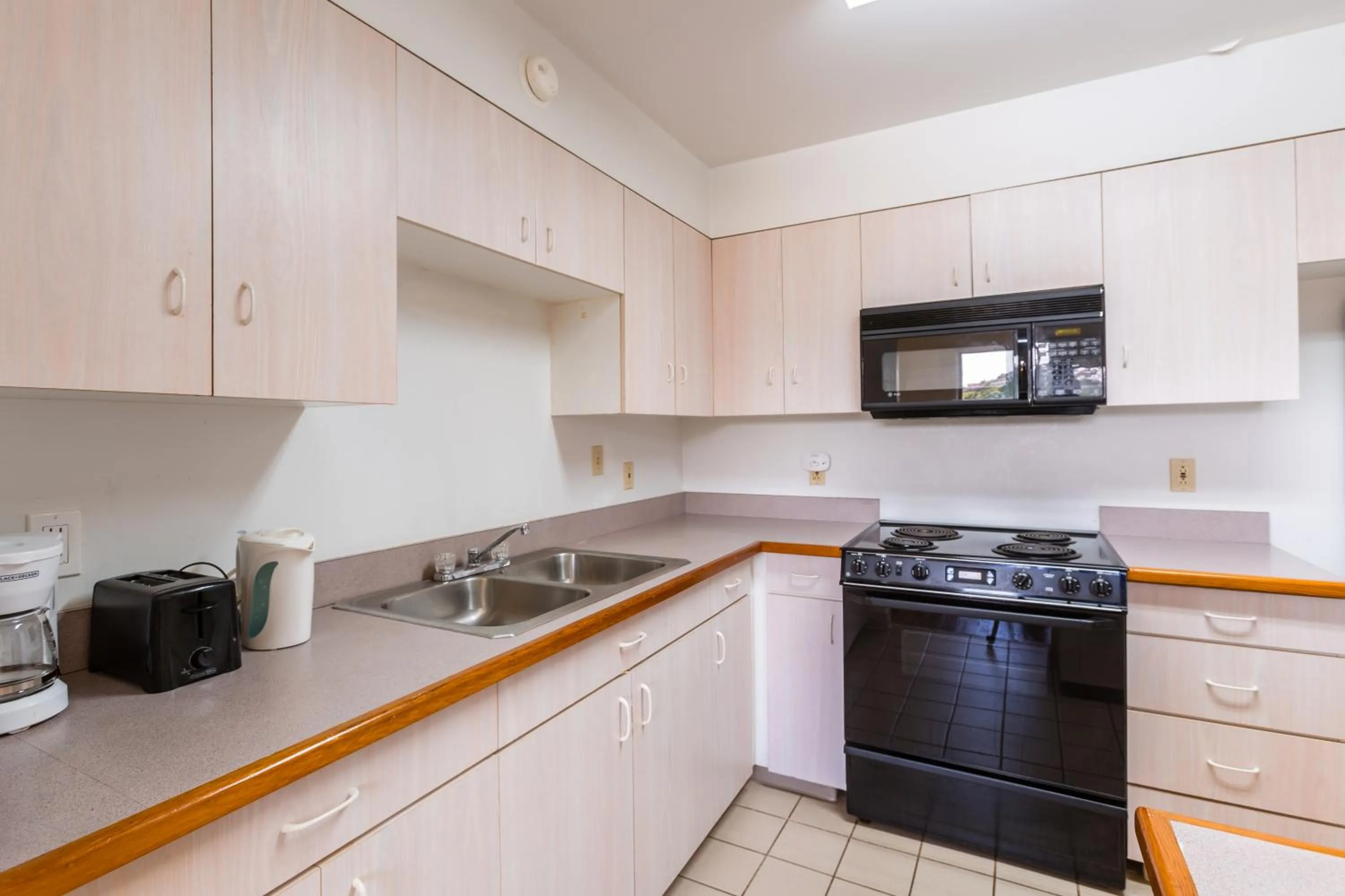 Kitchen or kitchenette in Alupang Beach Tower