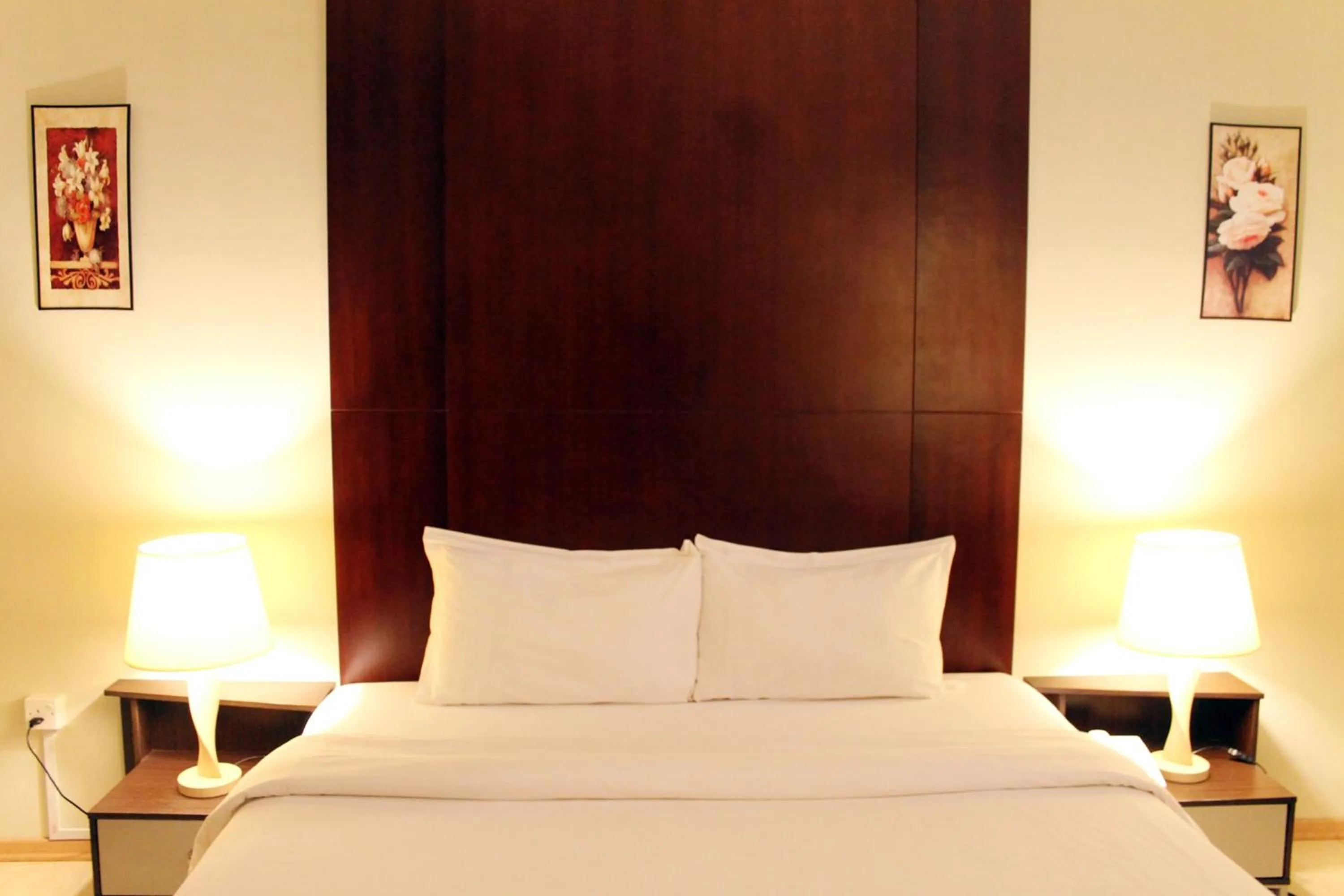 Bed in Ginasuite Hotel