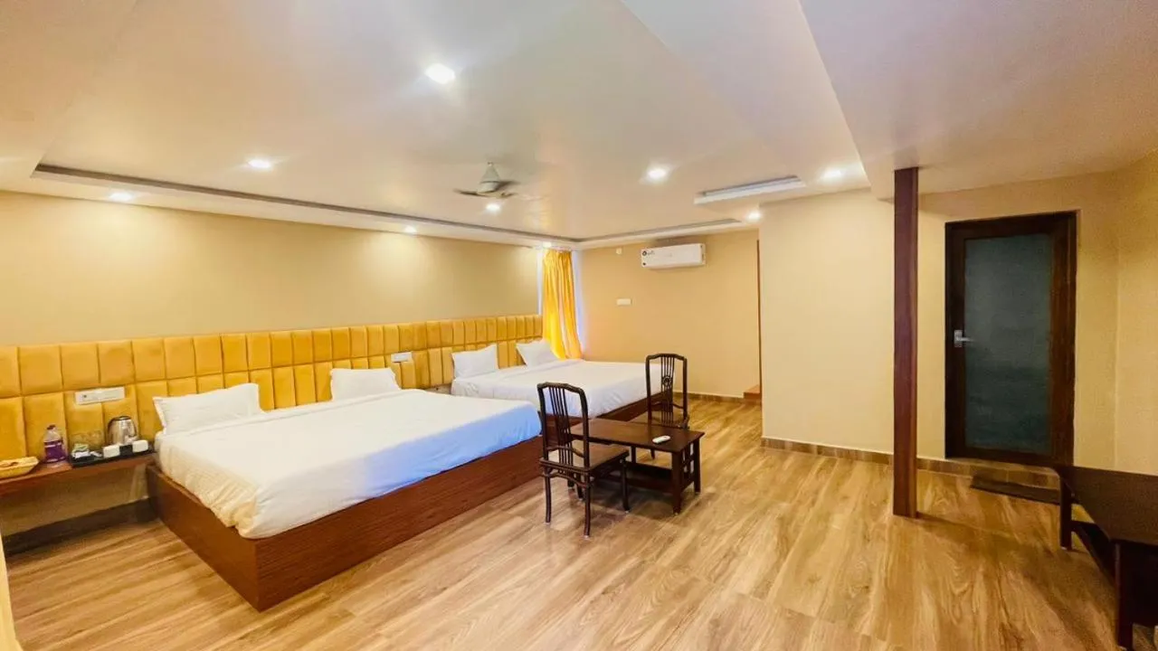 Photo of the whole room, Bed in Magizhvanam