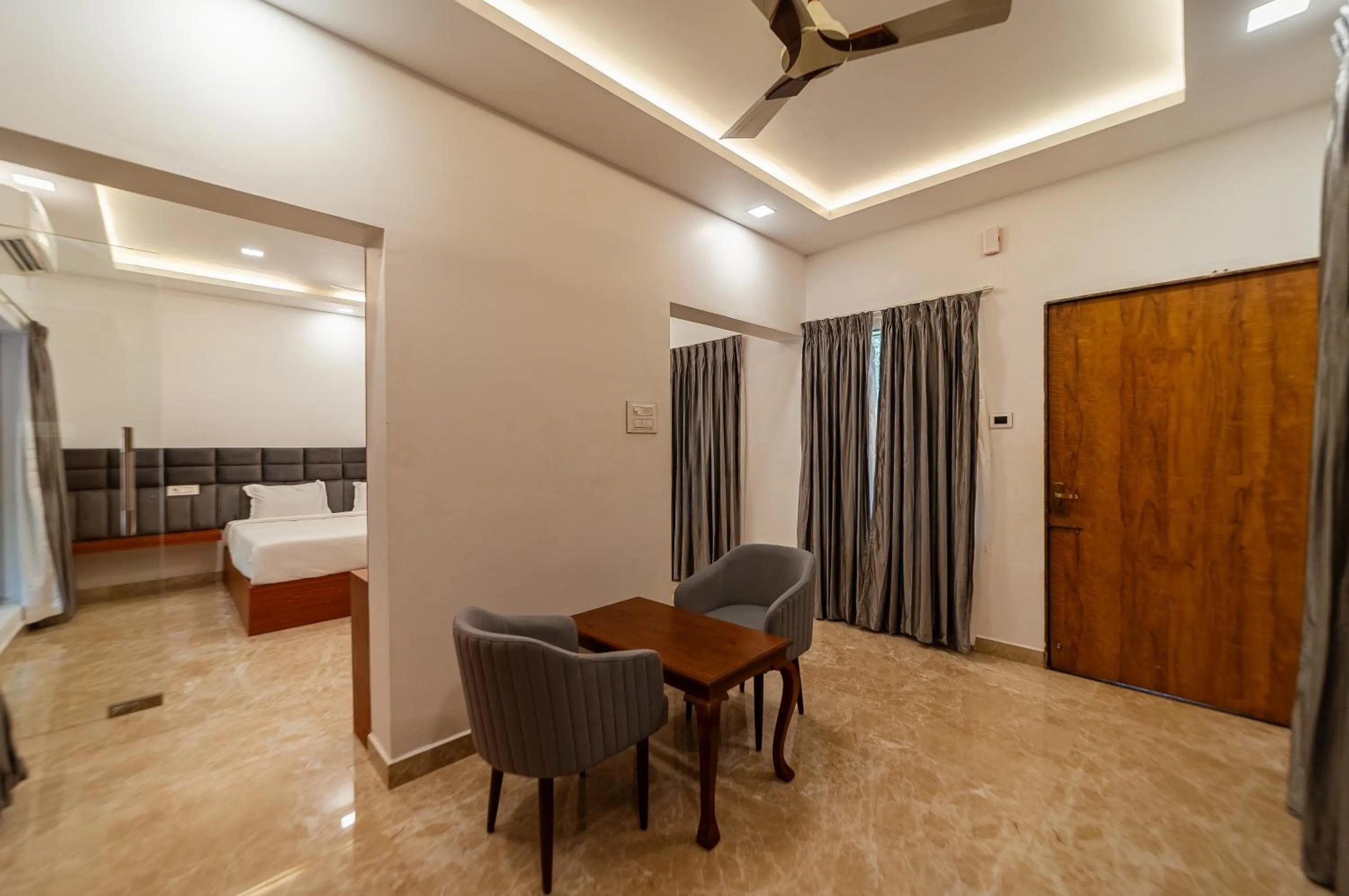 Seating area, Bed in Magizhvanam