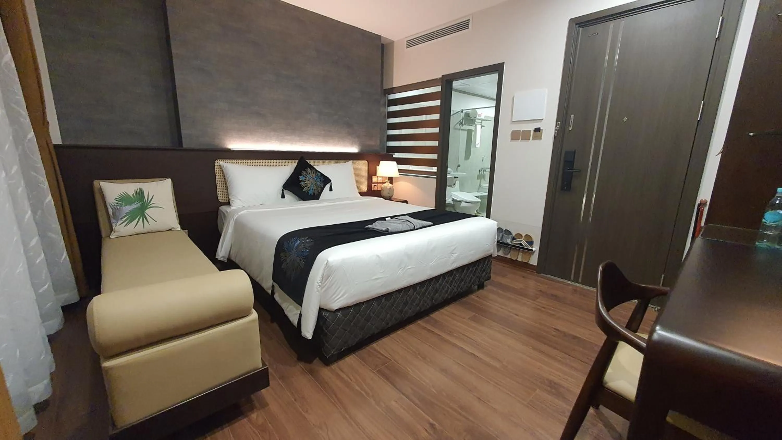 Photo of the whole room, Bed in MOMIZI HANOI 2 - PHAN KE BINH