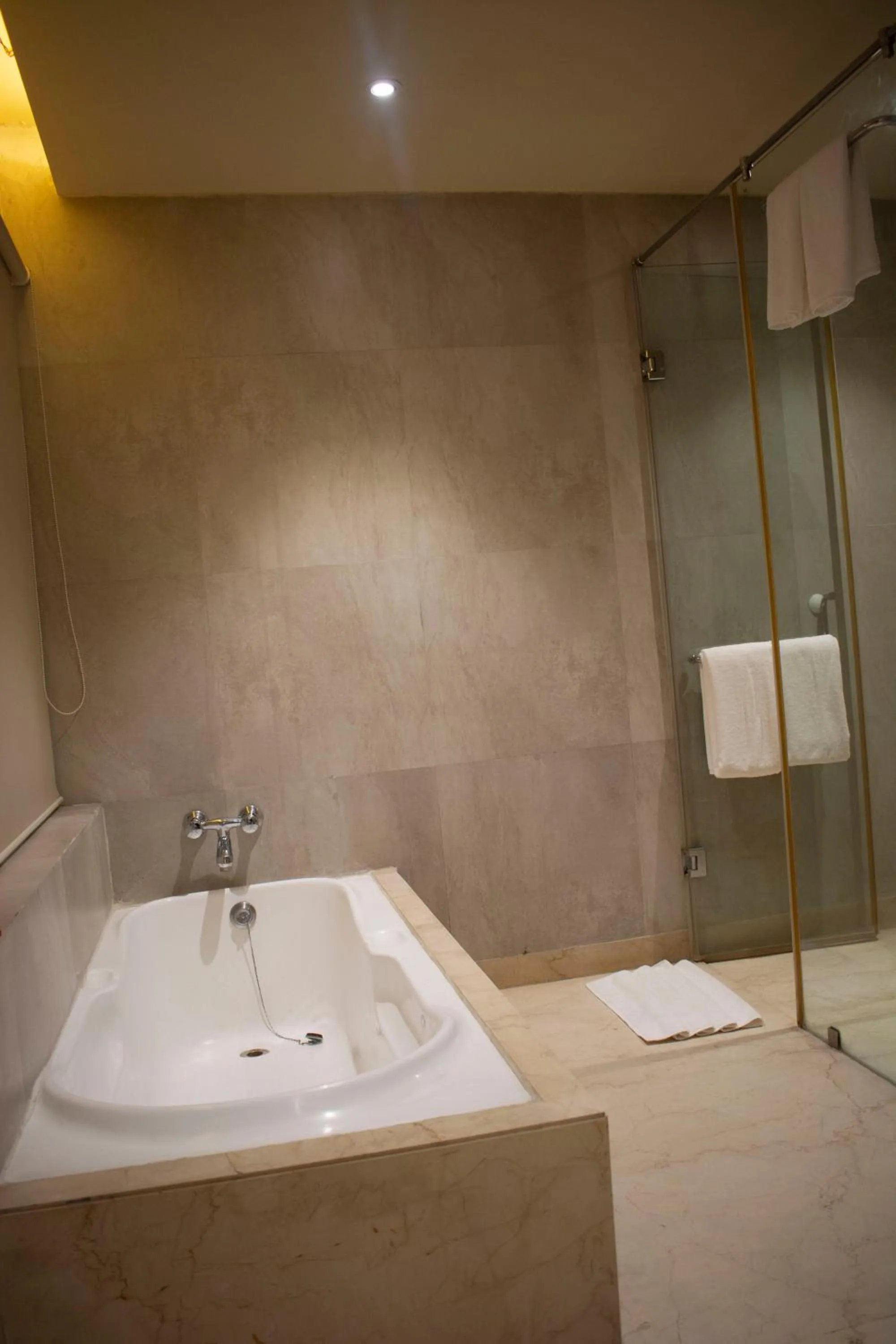 Bathroom in Regenta Orkos Kolkata by Royal Orchid Hotels Limited