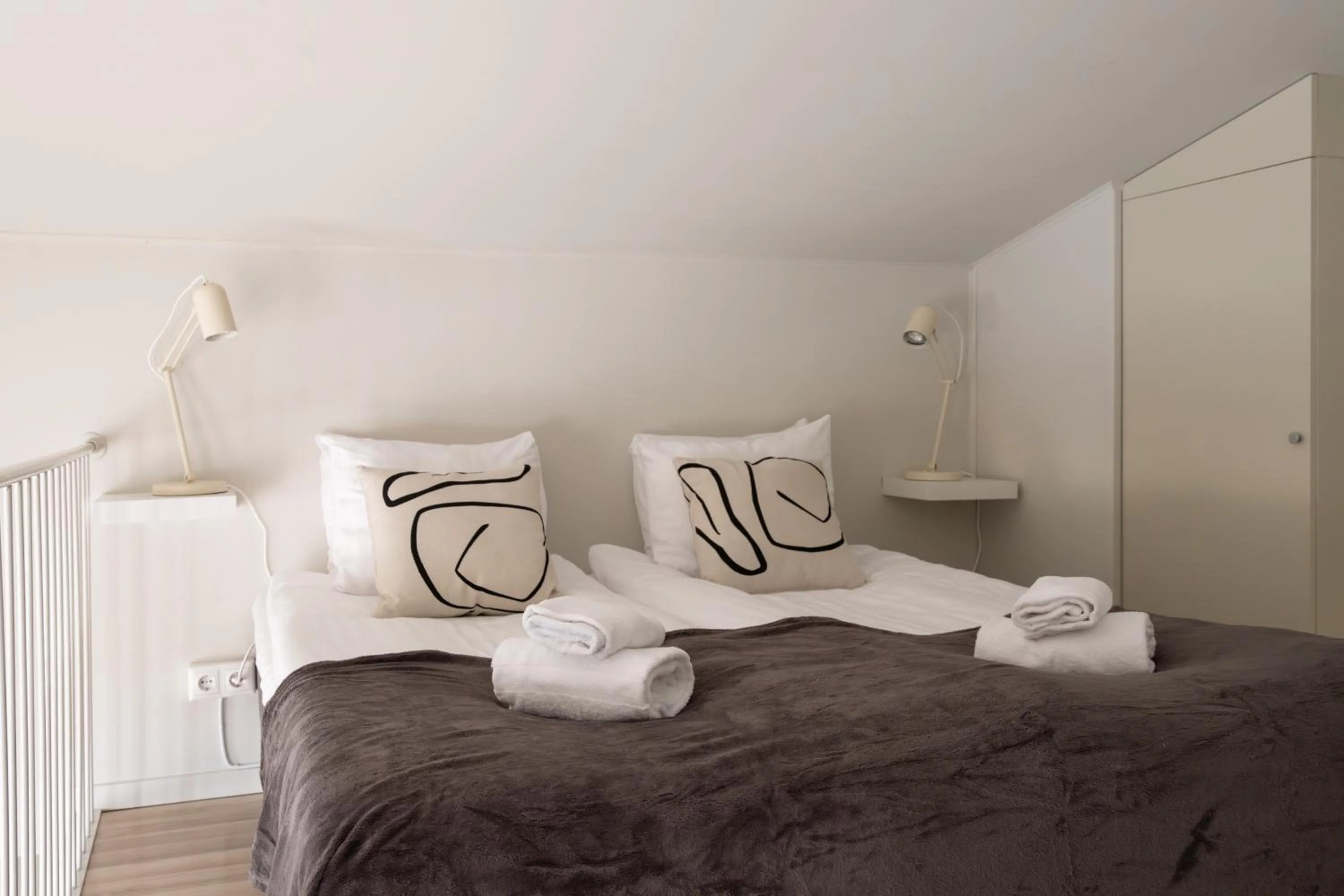 Bed in Waterfront Cabins