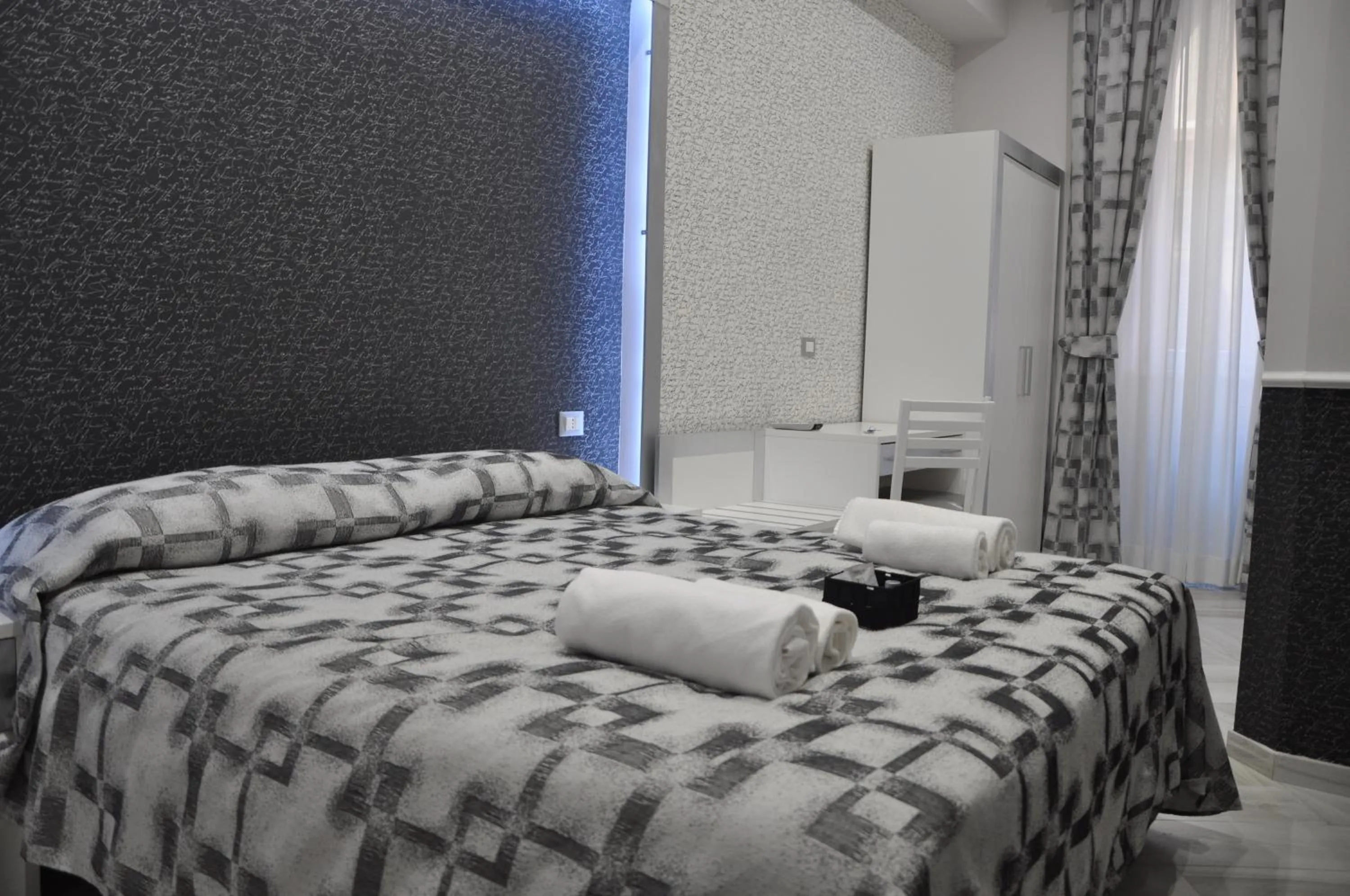 Bed in Il Corso Suite