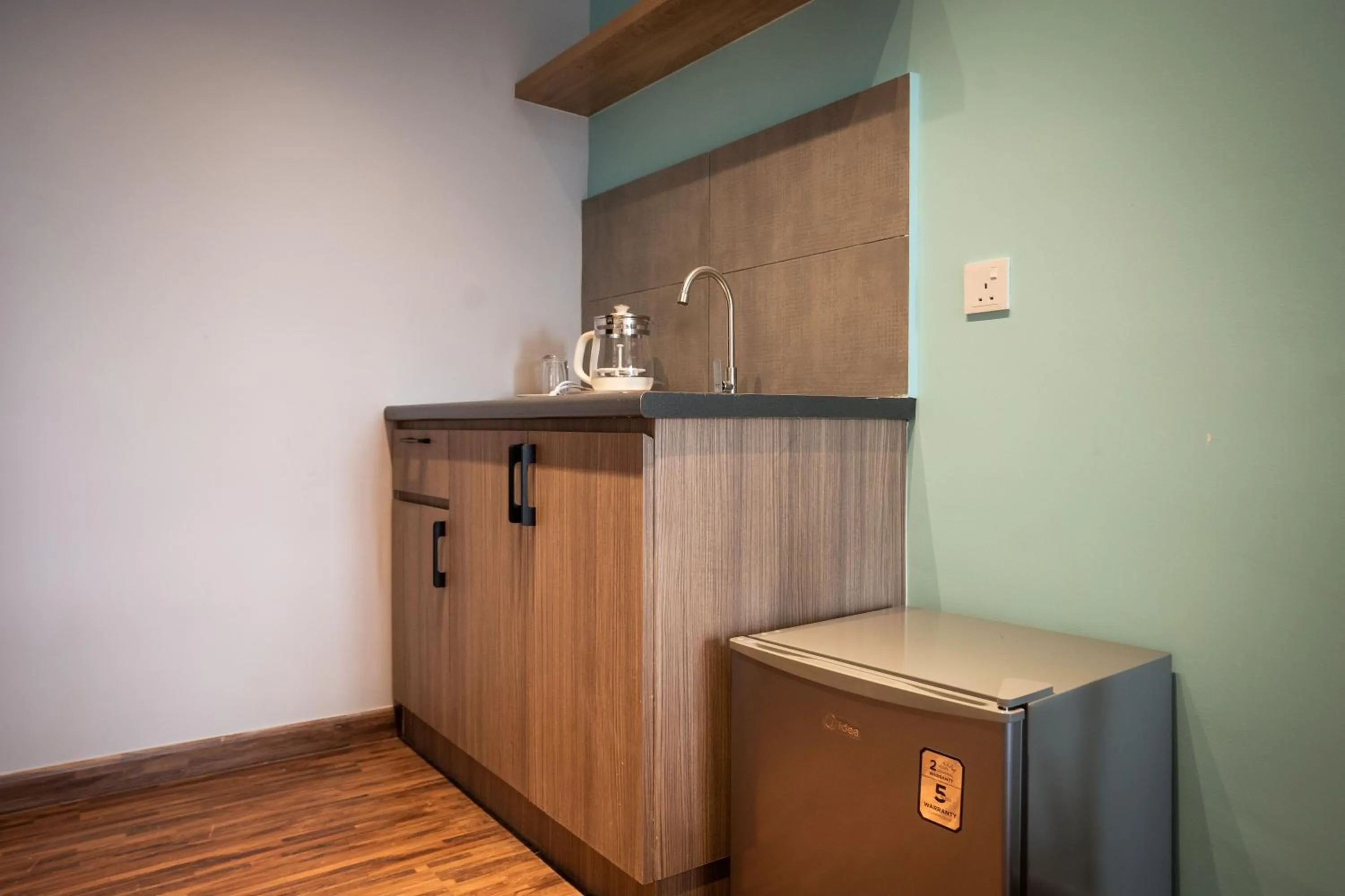 Kitchen or kitchenette in K Avenue by Pinstay