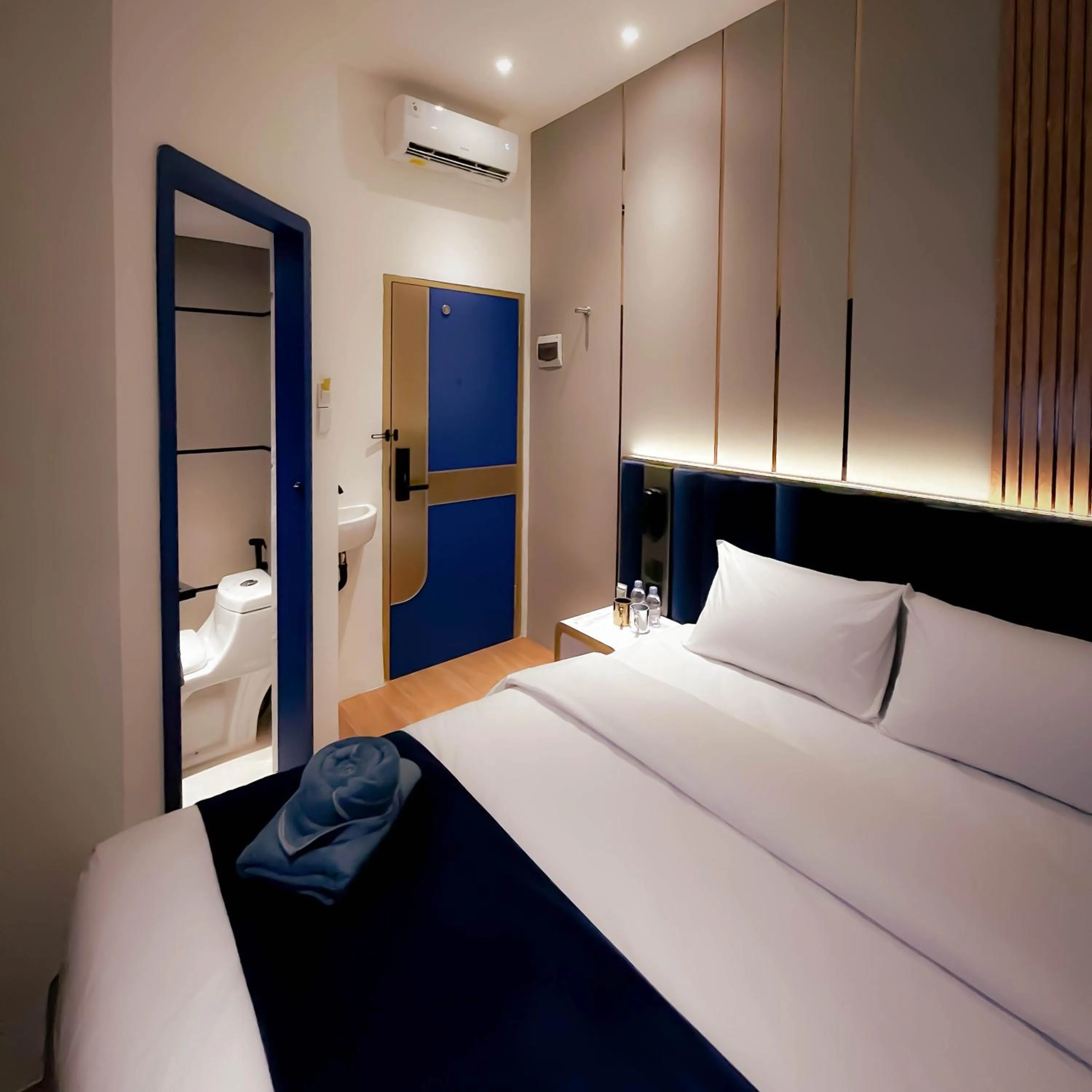 Bedroom, Bed in Qube Hotel by 98hospitality