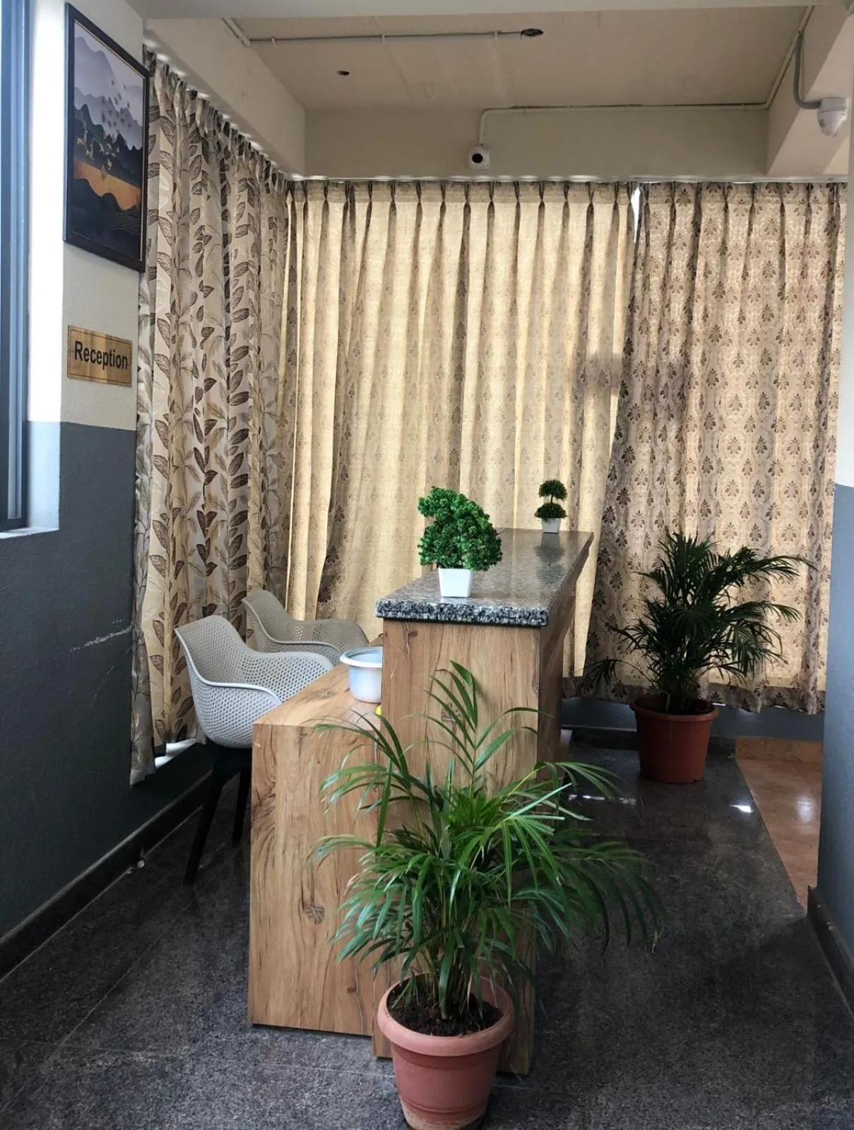 Seating area, Bed in Hotel Amulya Regency