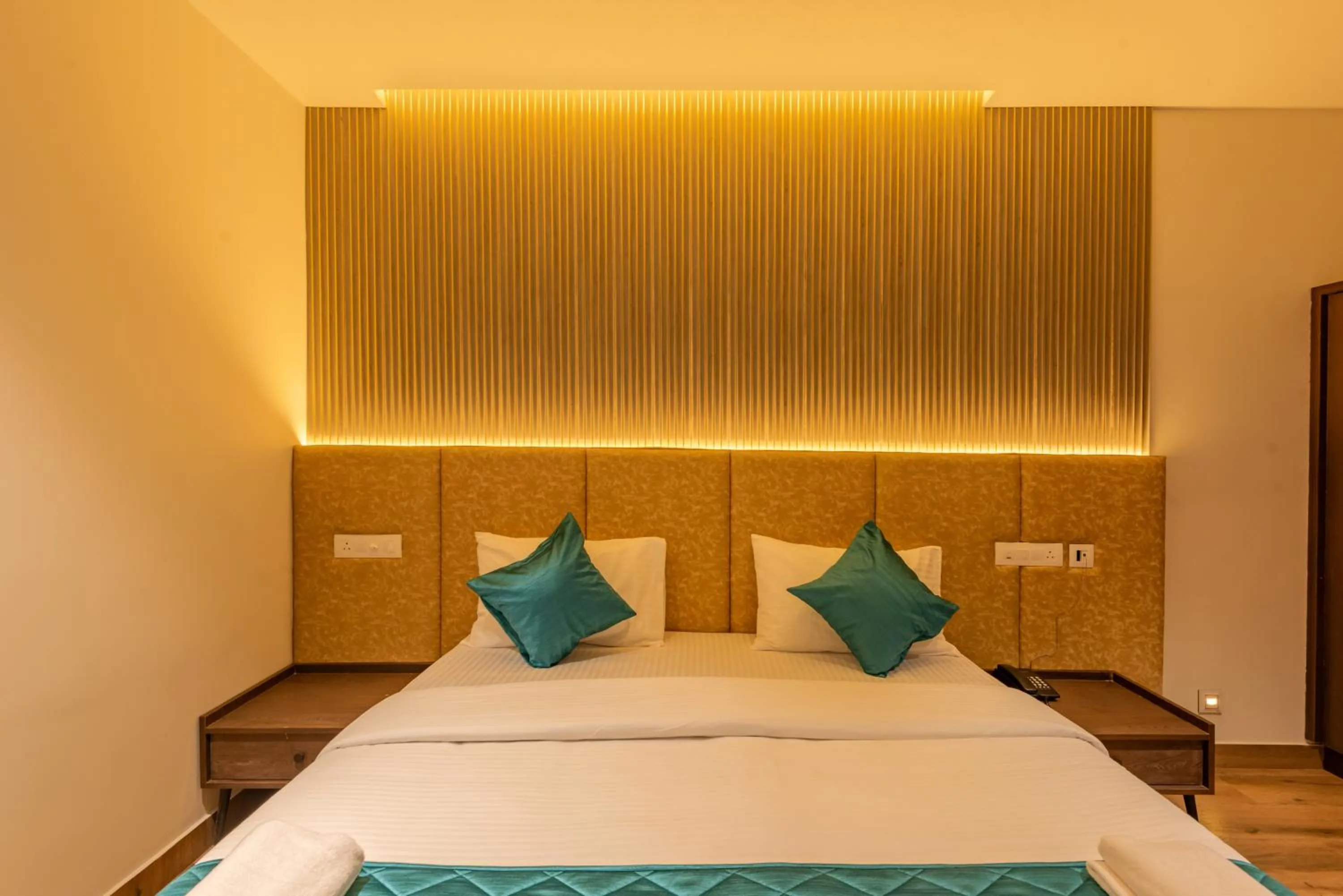 Bed in Hotel Stay Bella Kozhikode