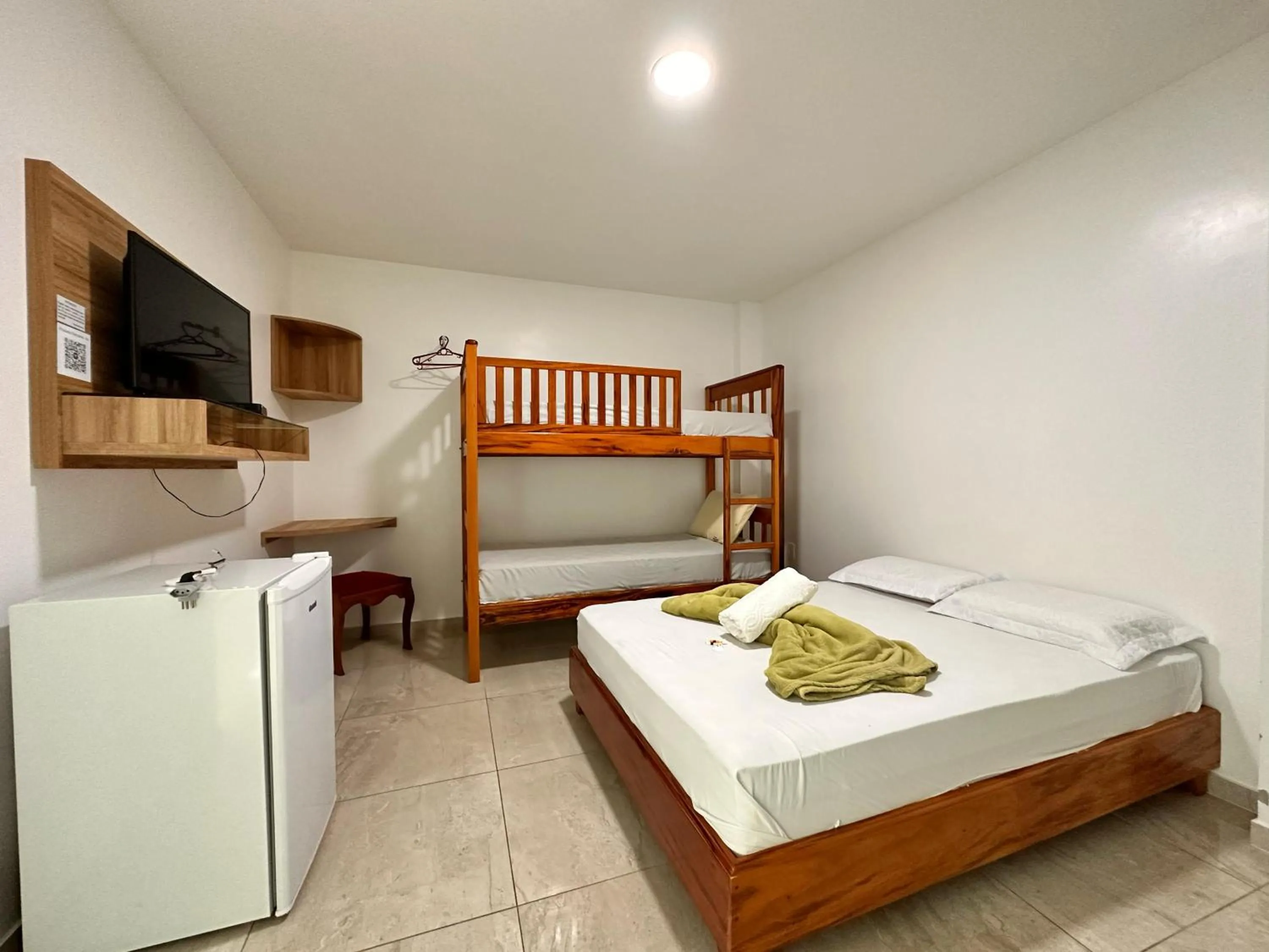 Bed in Pousada Diamante