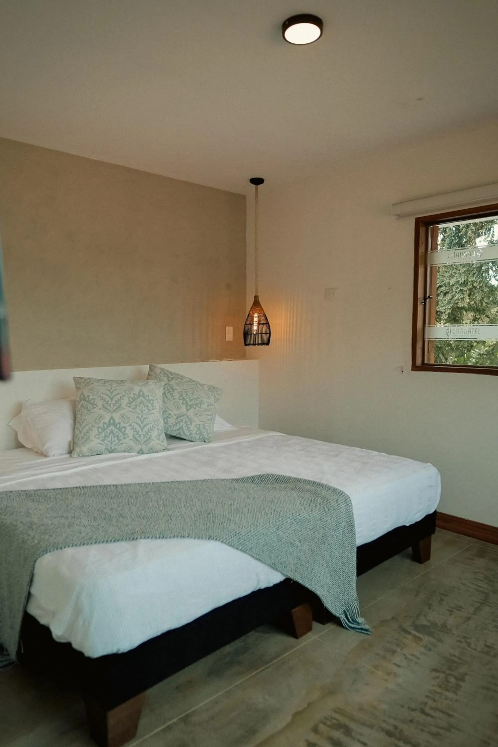 Bed in Cannatel Exclusive Hotel