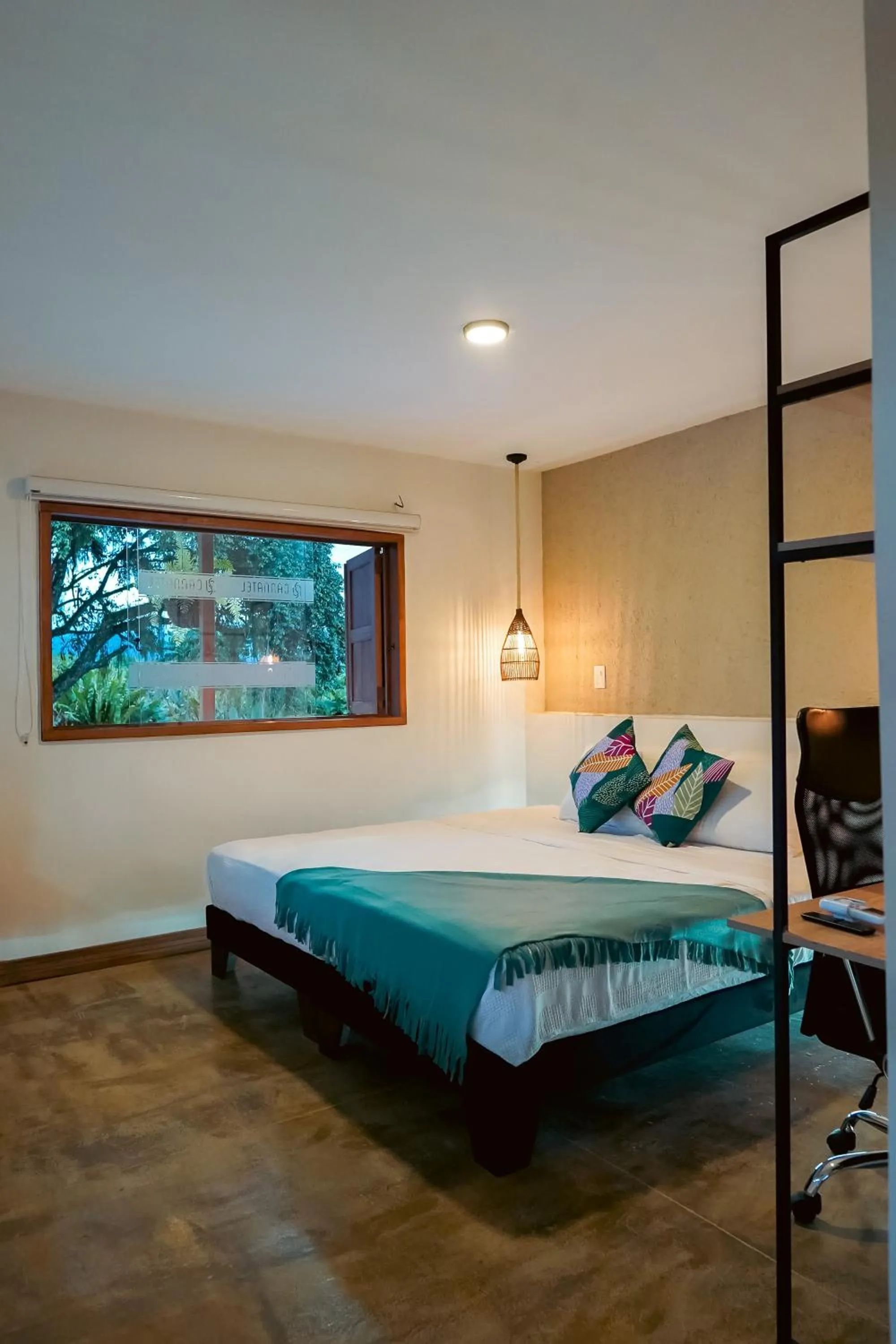 Bed in Cannatel Exclusive Hotel