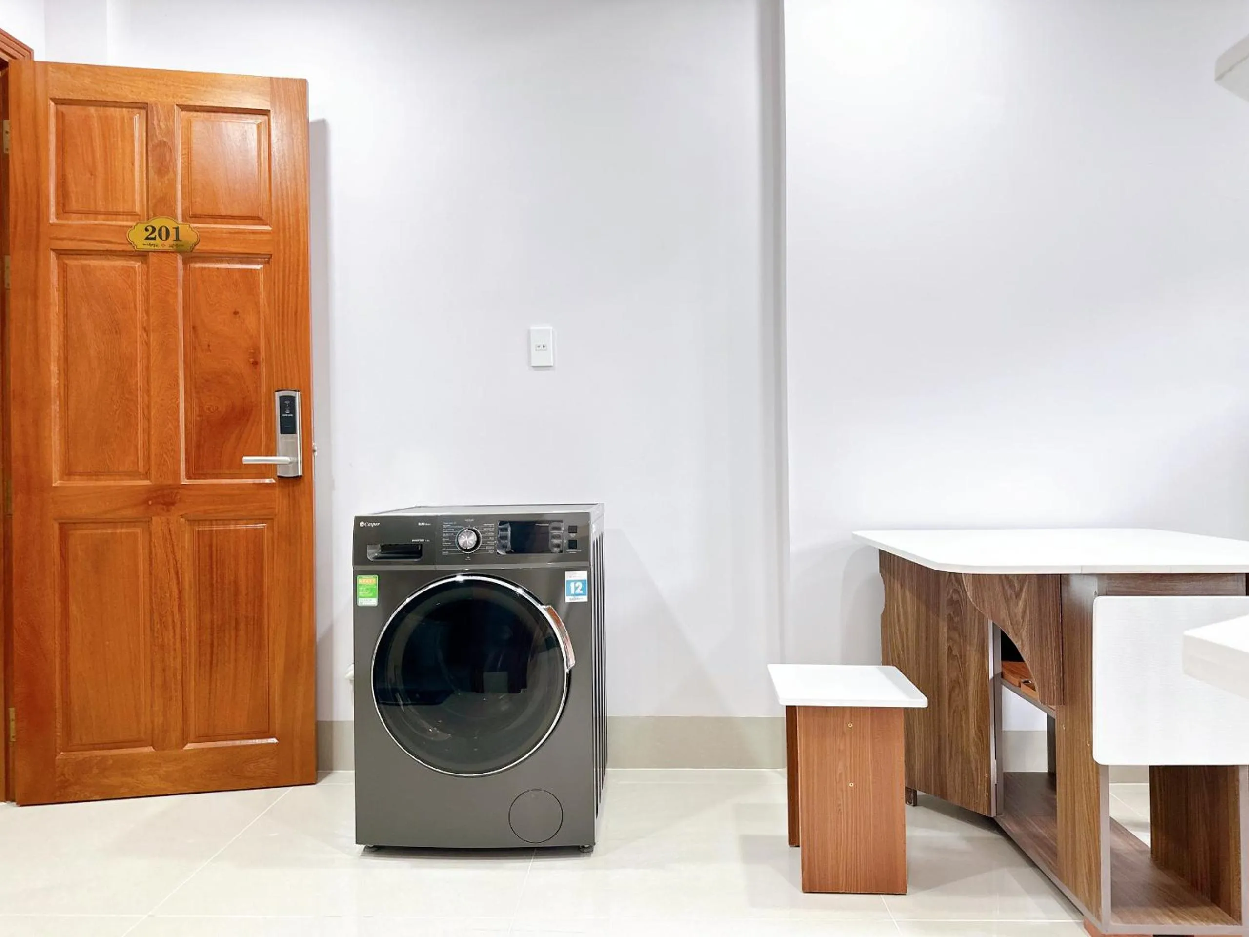washing machine in Milanesa Hotel and Apartment