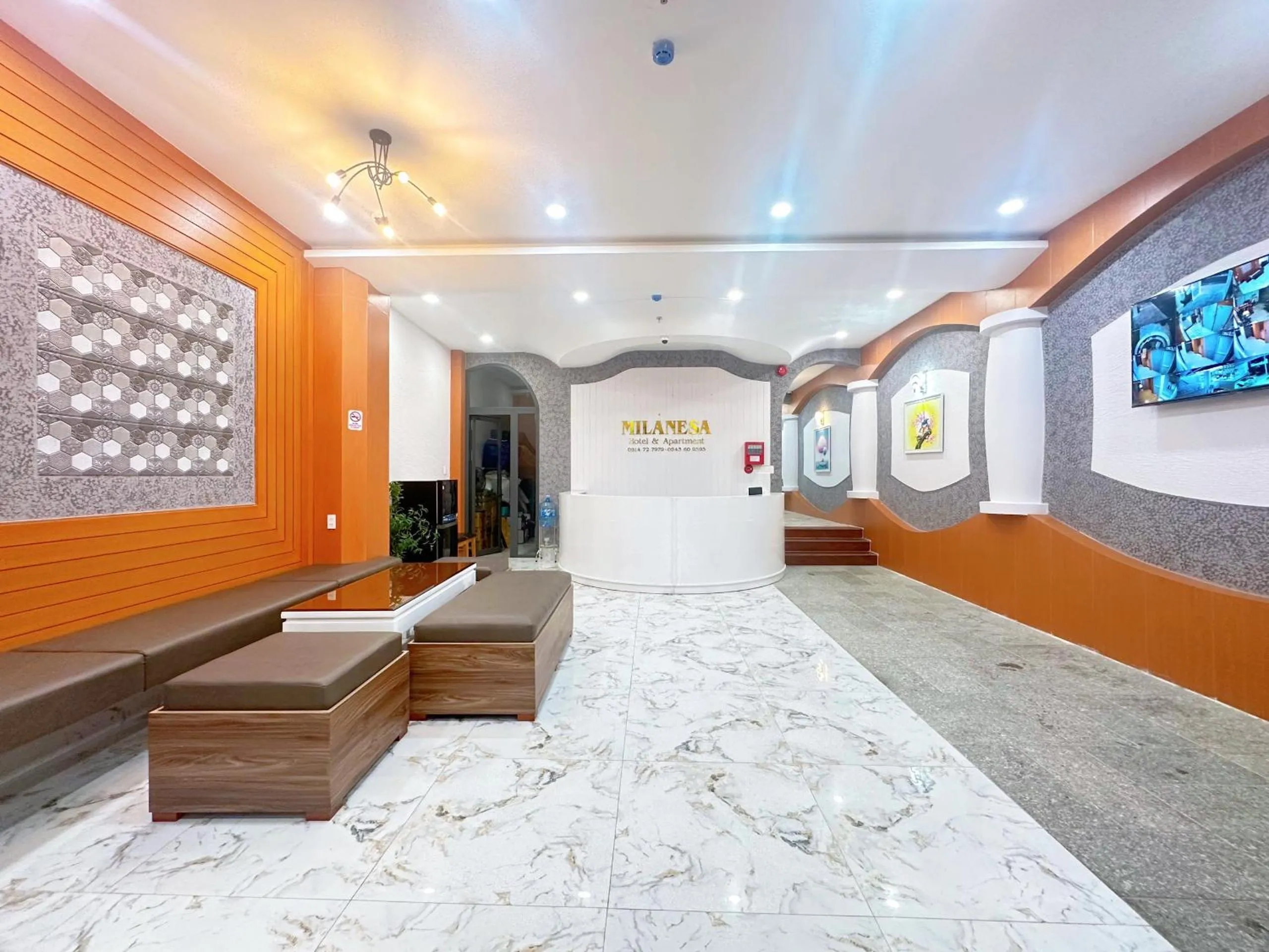 Communal lounge/ TV room in Milanesa Hotel and Apartment