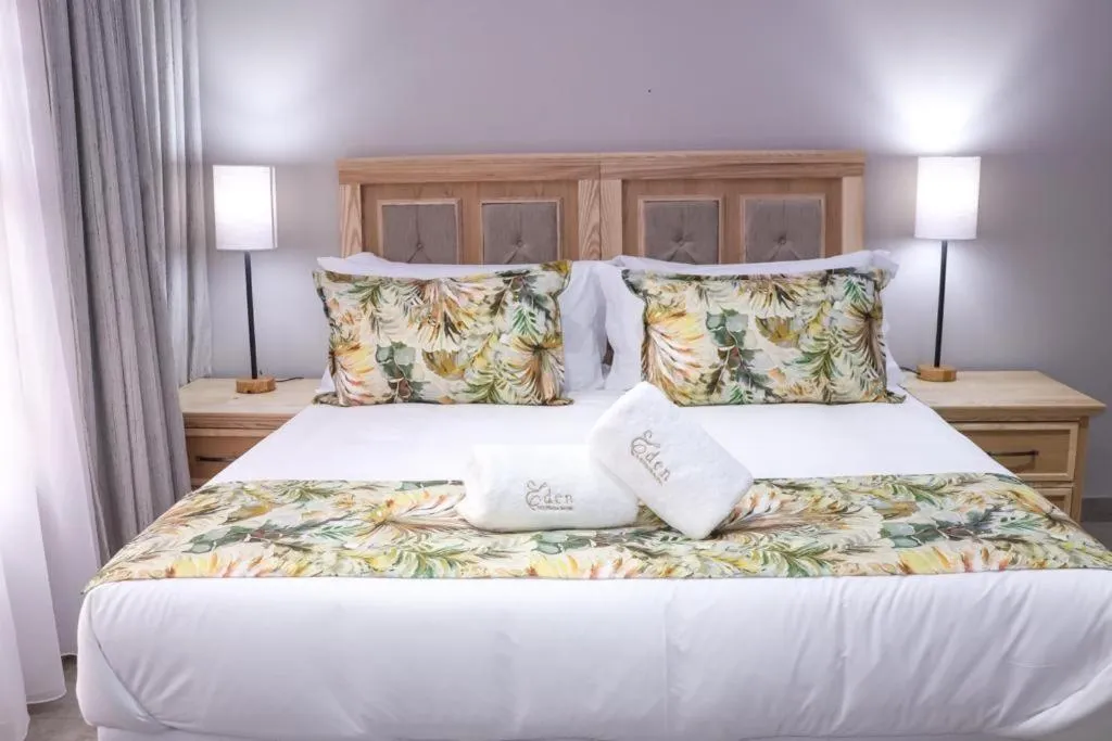 Bed in EDEN BOUTIQUE HOTEL