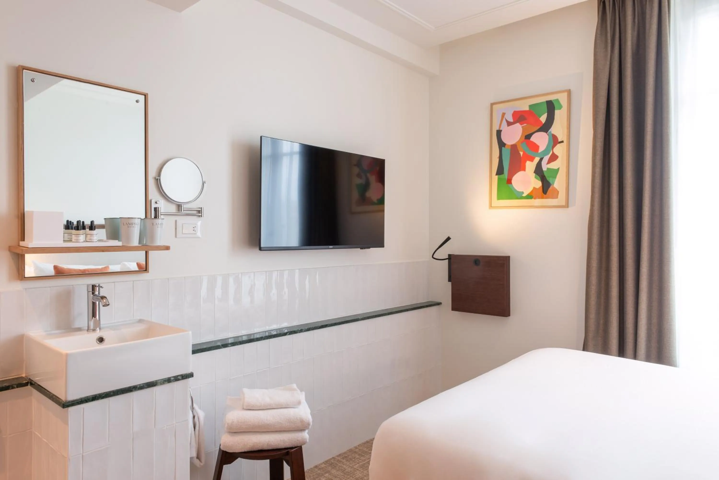 Bed in Le Lampika Hôtel