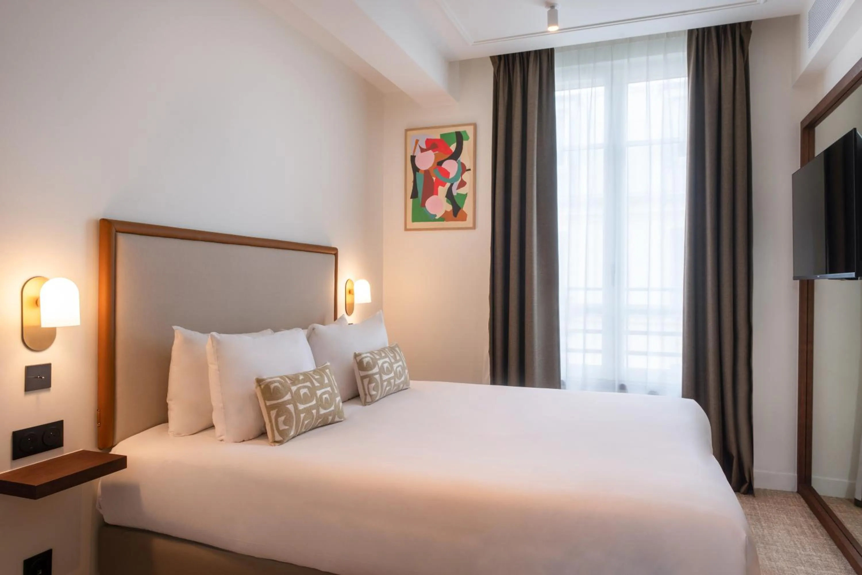 Bed in Le Lampika Hôtel