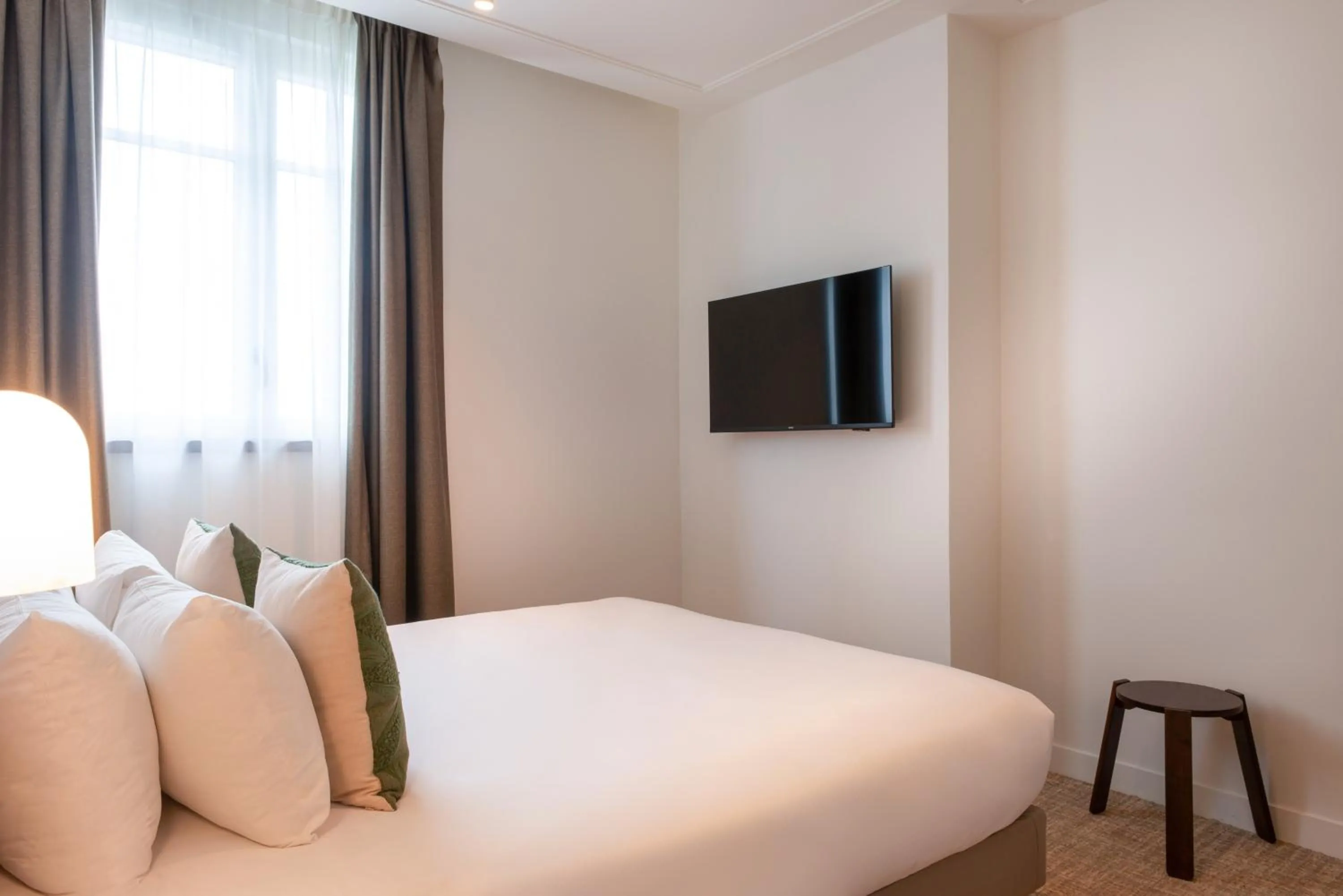 Bed in Le Lampika Hôtel