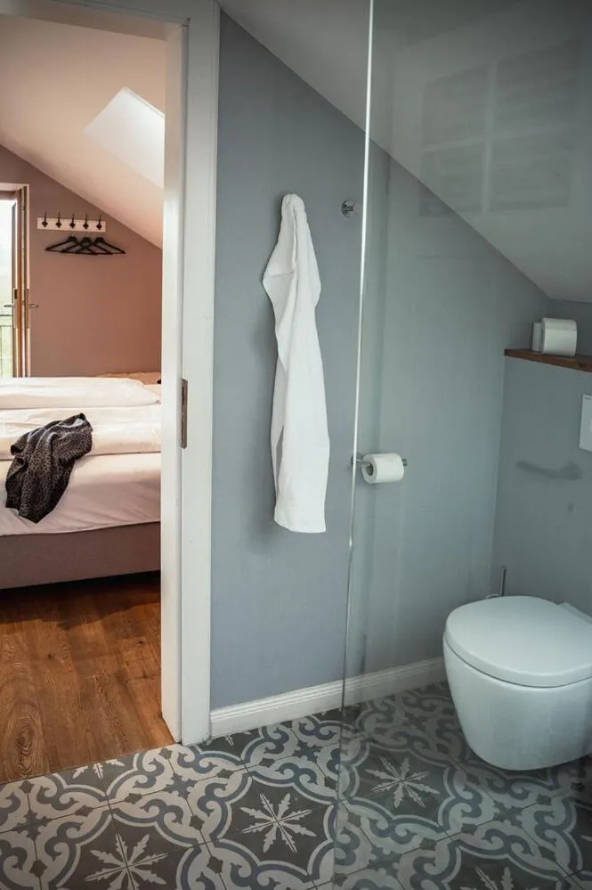 Bathroom, Bed in Allgäuer Genusshotel und Historischer Dorfgasthof Hirsch