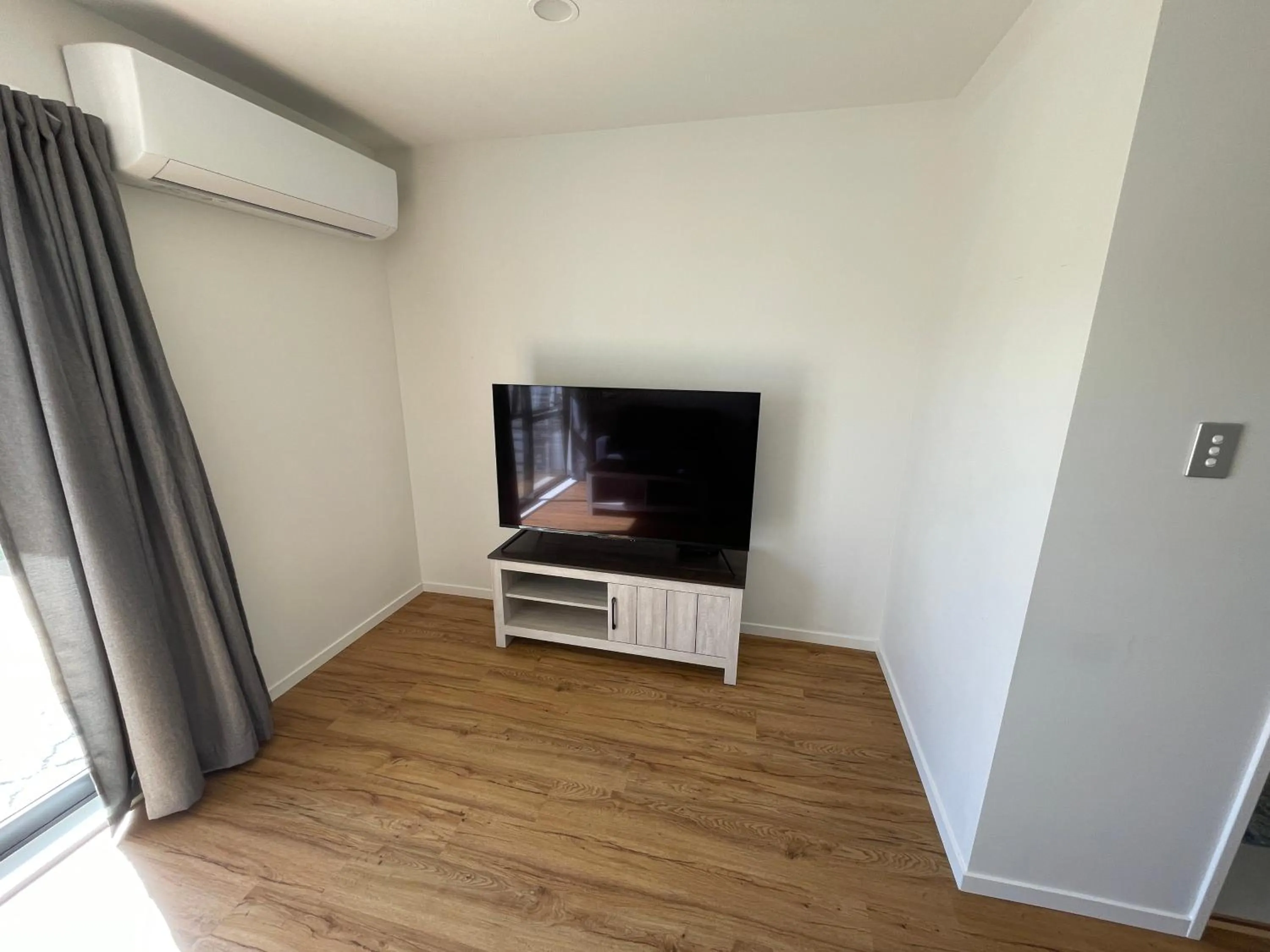 TV and multimedia in Modern Home by the Reserve