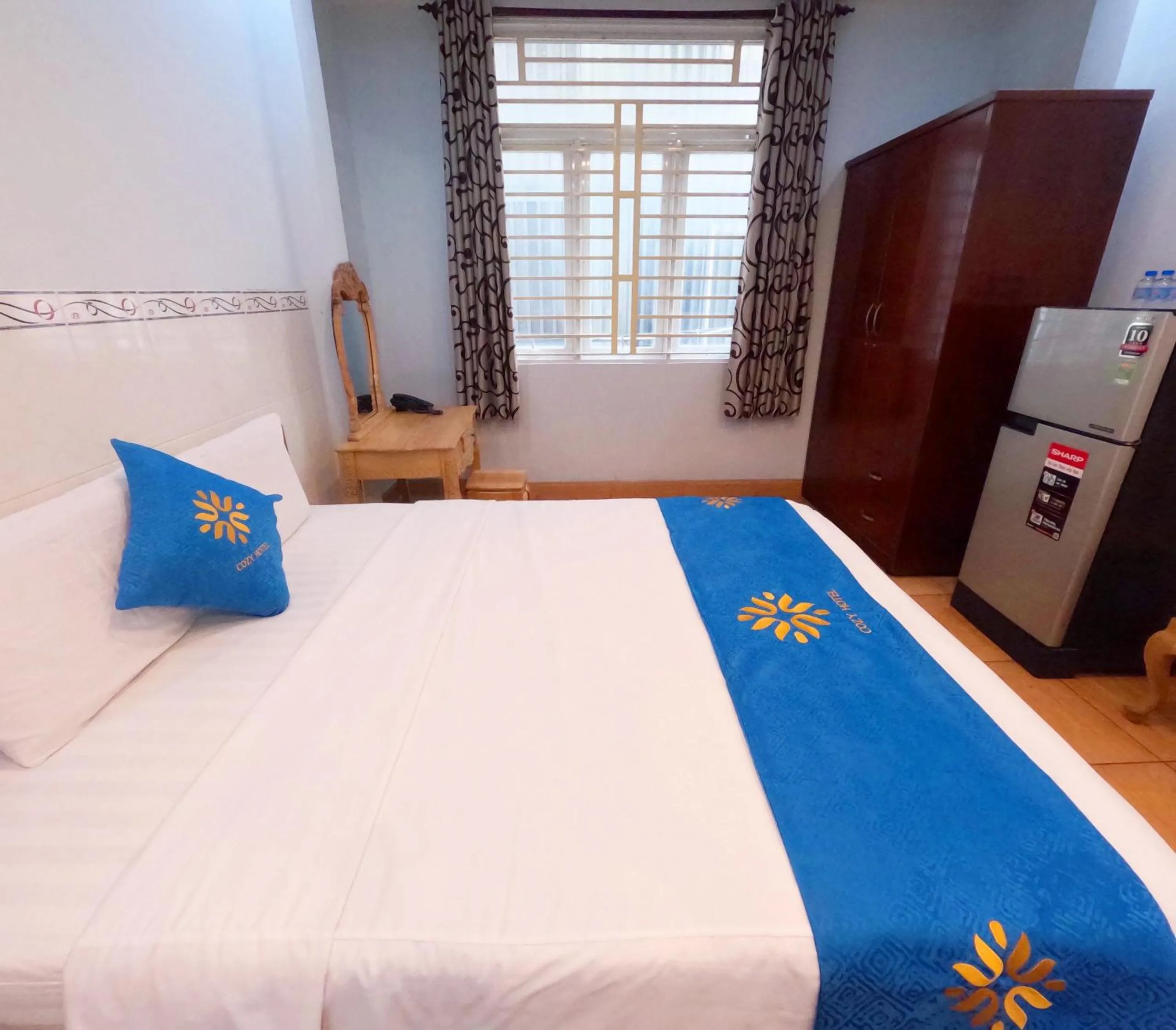 Bed in COZY Hotel HCM