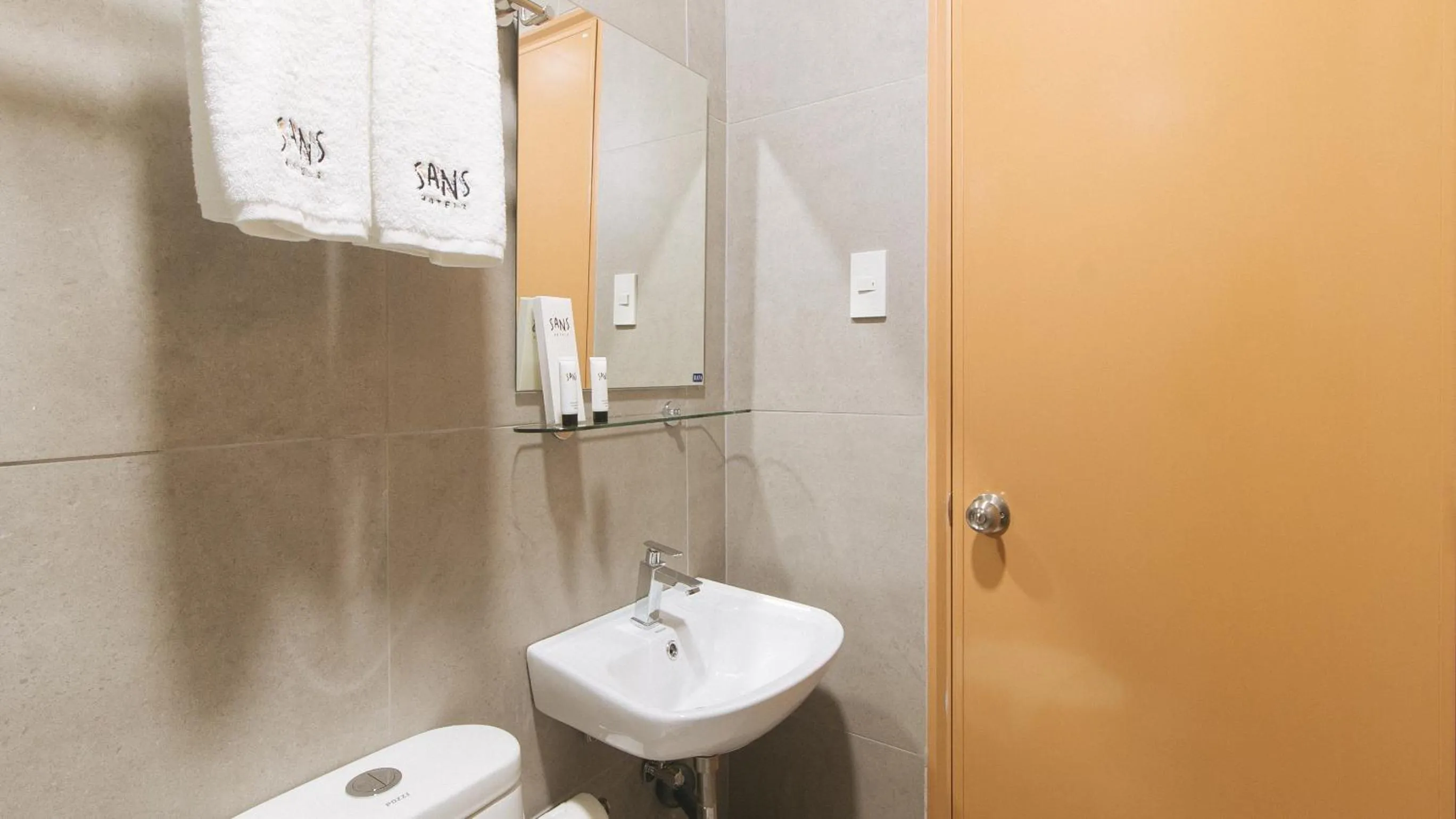 towels in Sans Hotel at One JD Place Makati by RedDoorz