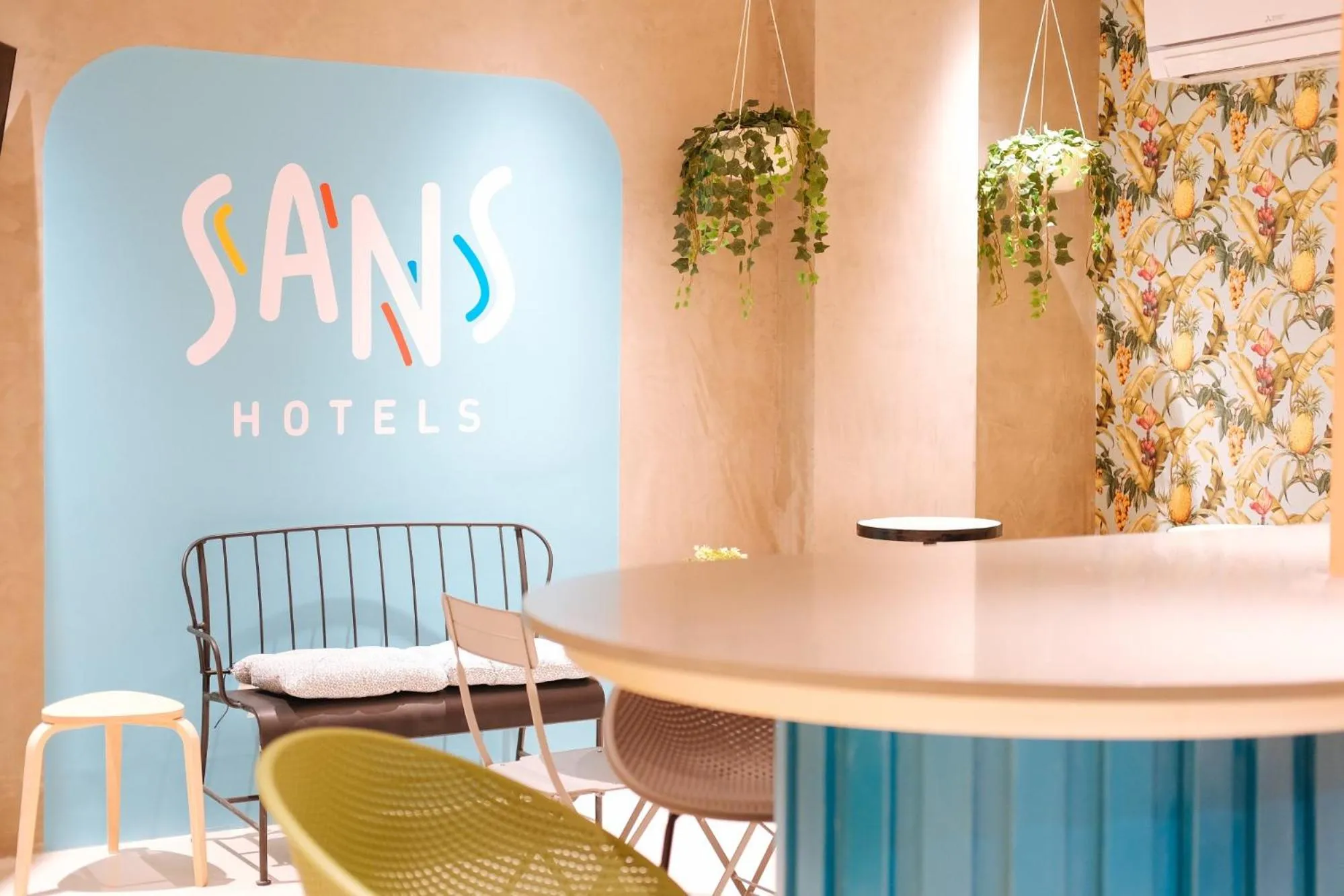 Seating area in Sans Hotel at One JD Place Makati by RedDoorz