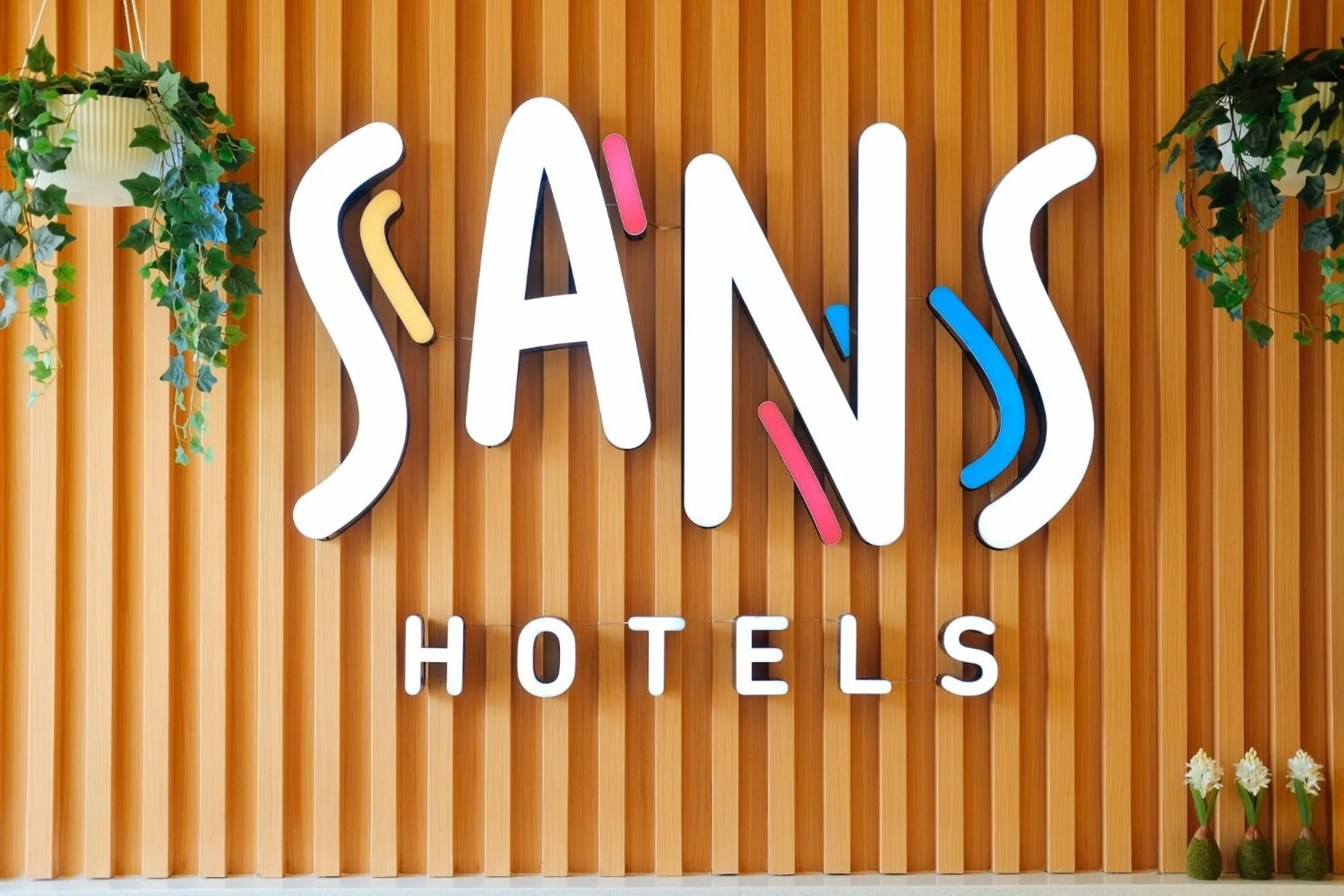 Property logo or sign in Sans Hotel at One JD Place Makati by RedDoorz