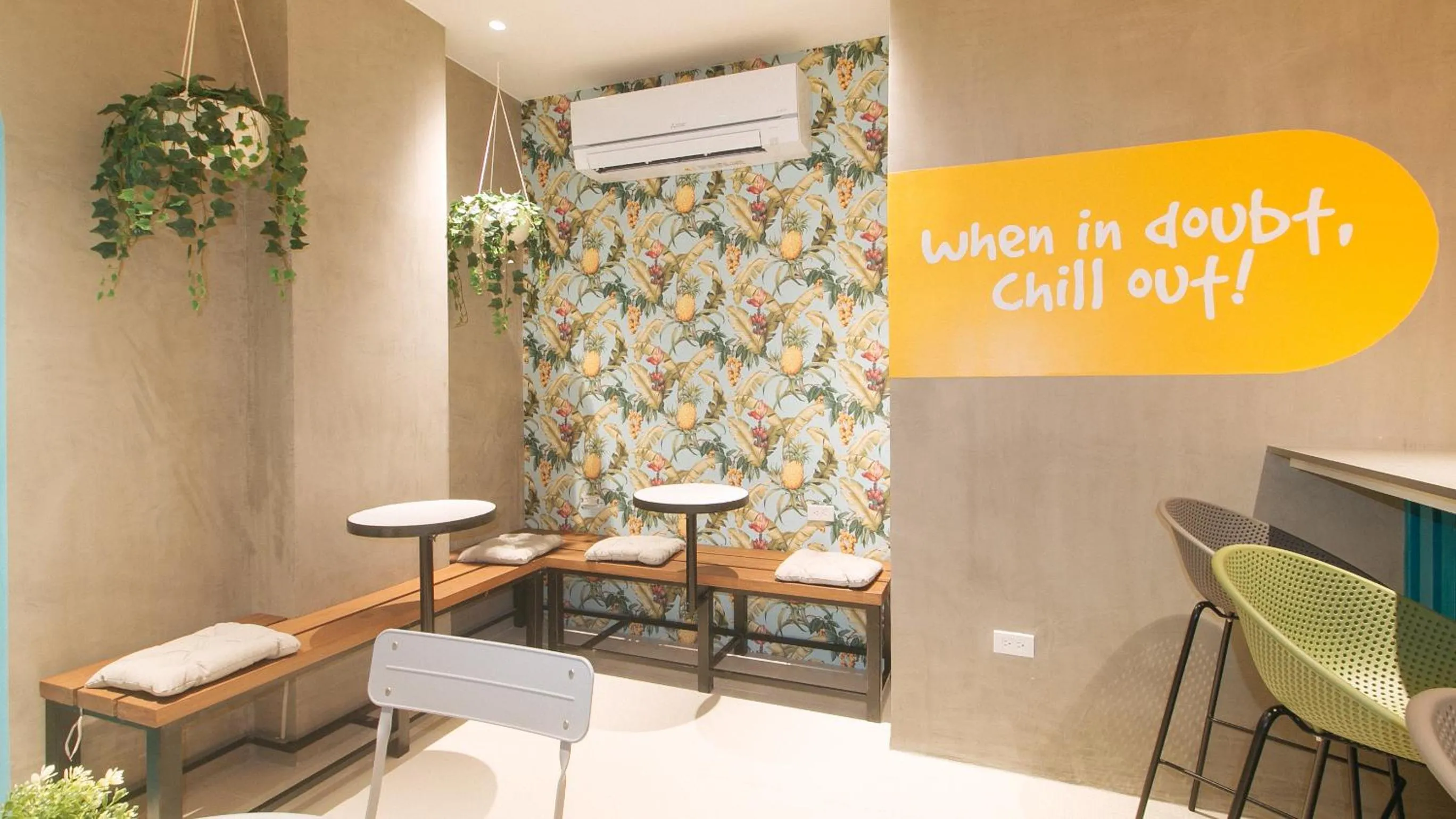 Seating area in Sans Hotel at One JD Place Makati by RedDoorz