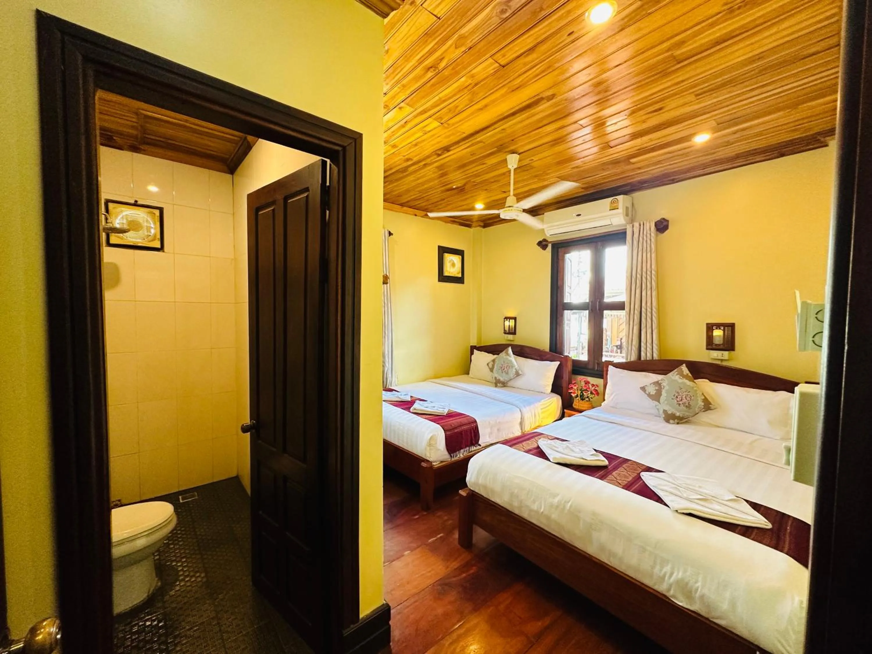 Bed in Anisa Mekong Riverside Villa